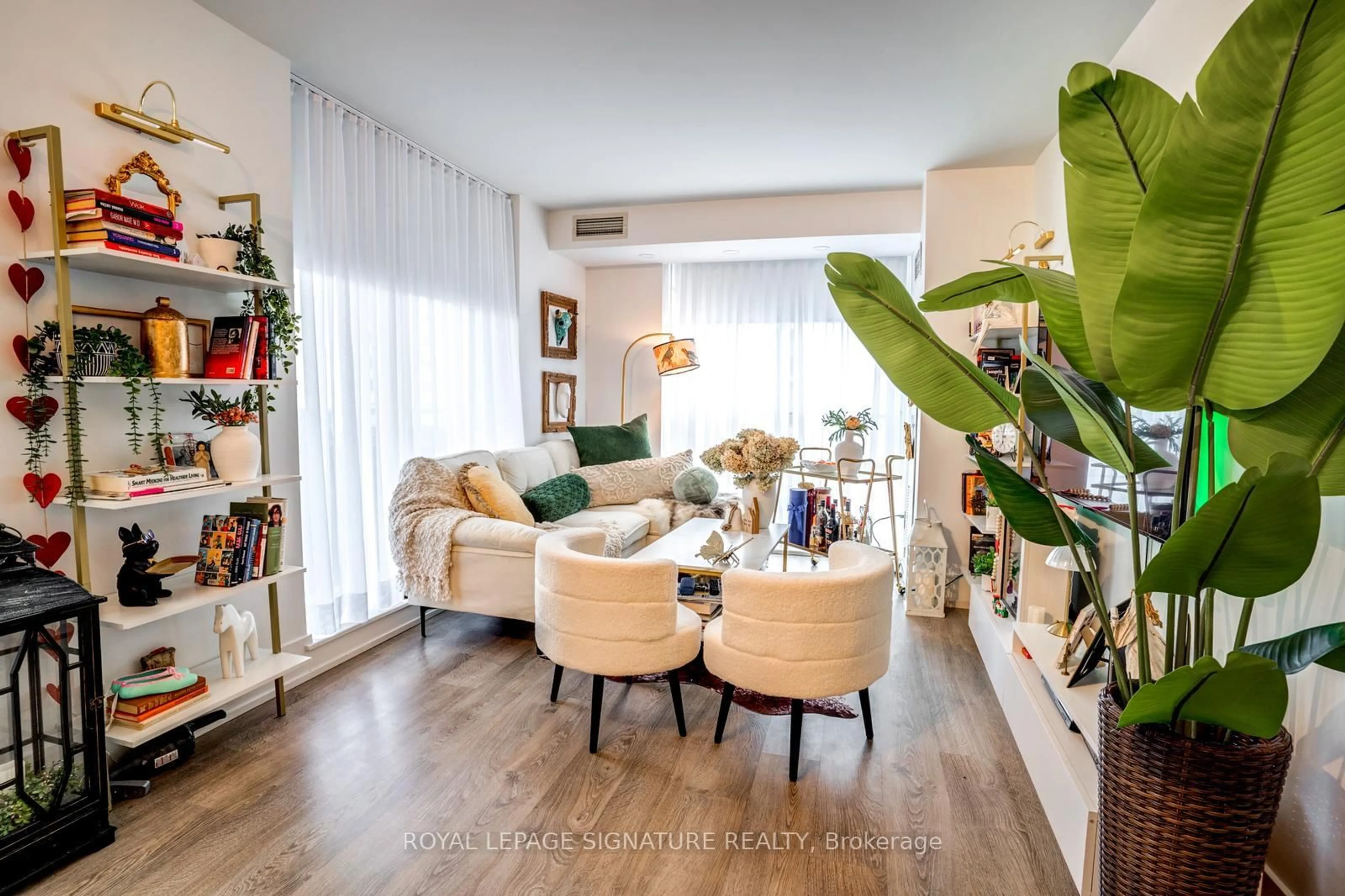 Living room with furniture, wood/laminate floor for 7 Michael Power Pl #1503, Toronto Ontario M9A 0A4