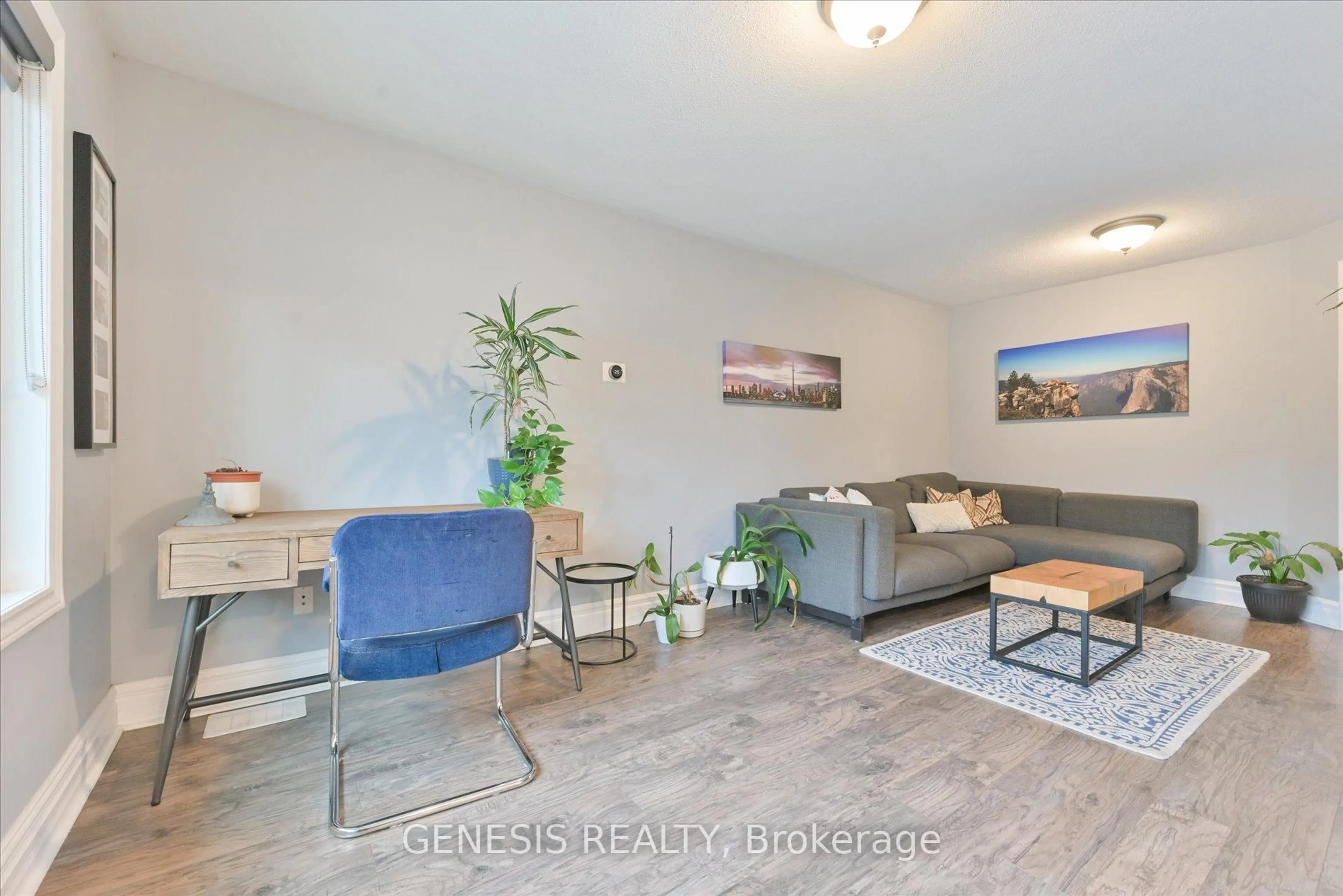 Living room with furniture, wood/laminate floor for 455 Caledonia Rd, Toronto Ontario M6E 4T9