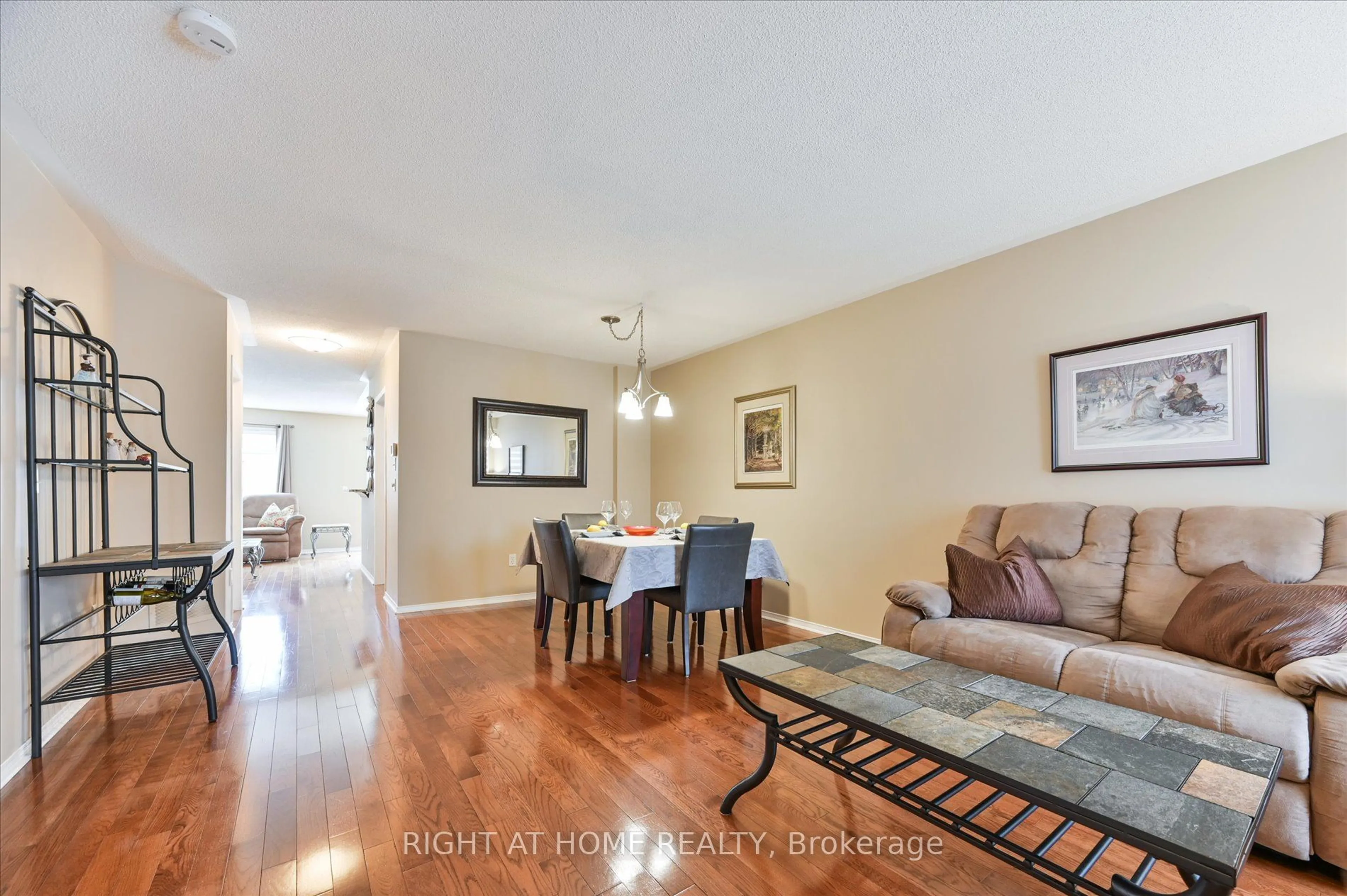 Living room with furniture, wood/laminate floor for 3802 Ridgepoint Way, Mississauga Ontario L5N 7T8