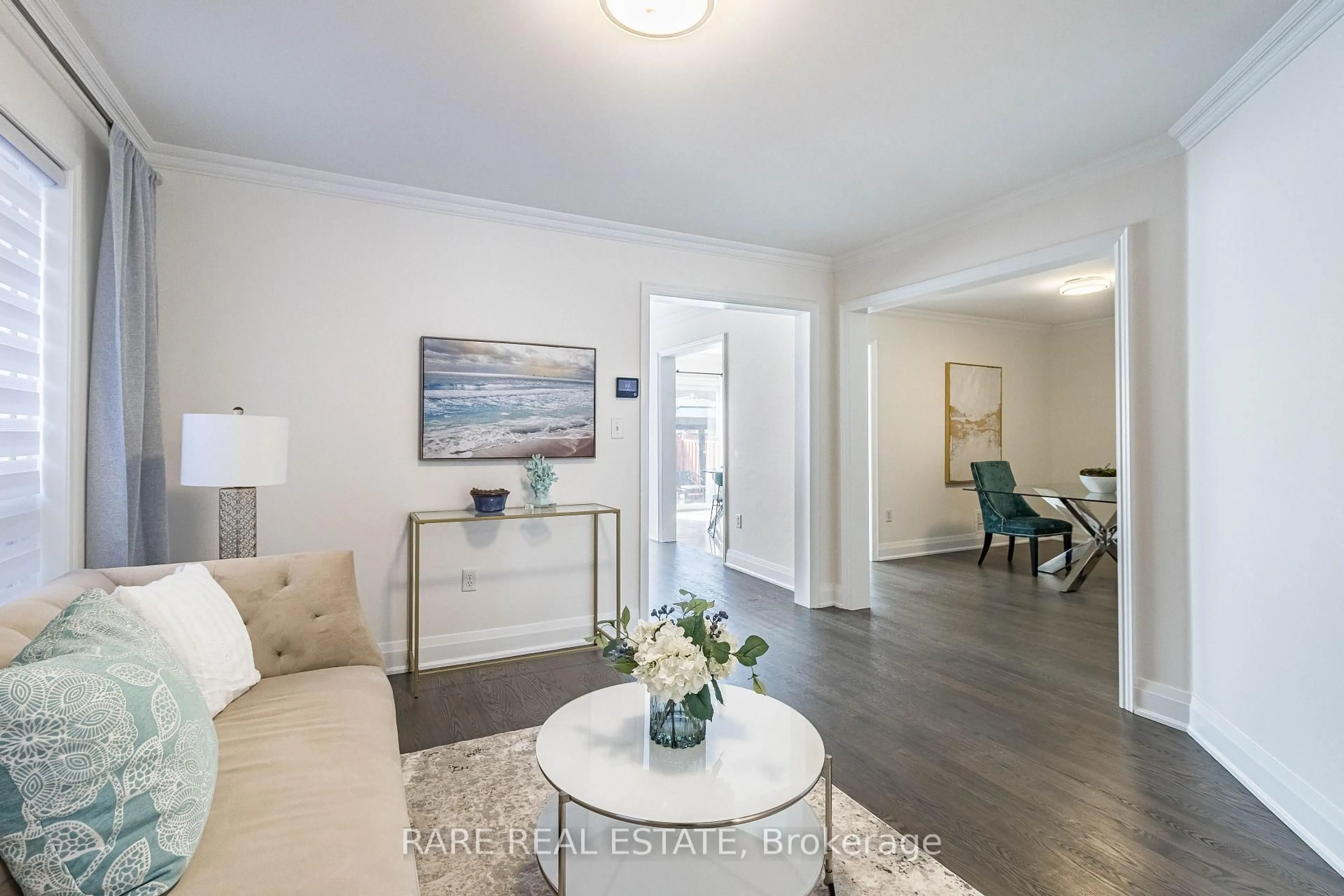 Living room with furniture, wood/laminate floor for 46 Bottomwood St, Brampton Ontario L6S 0B3