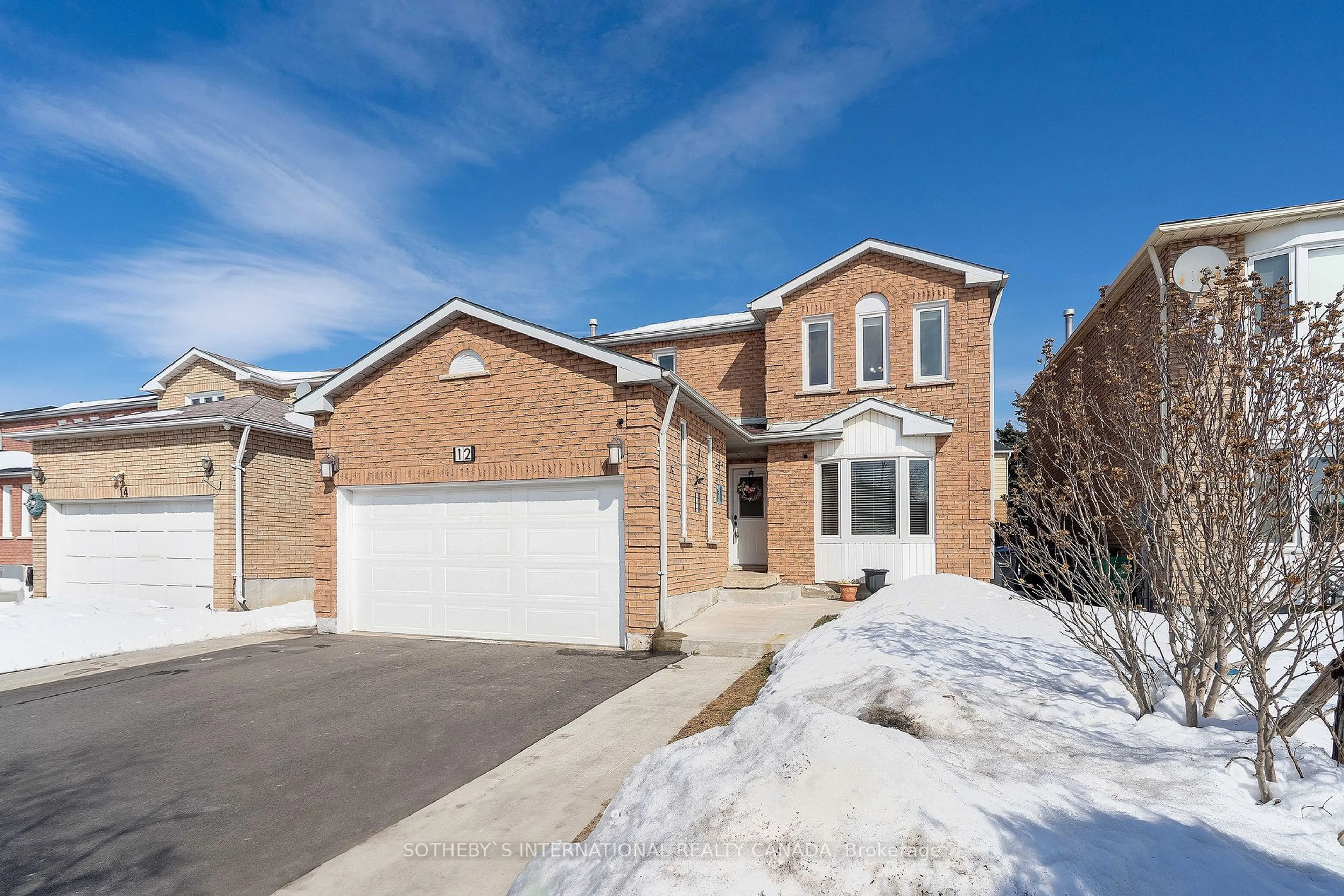 Home with brick exterior material, street for 12 Duggan Dr, Brampton Ontario L6Y 4K8