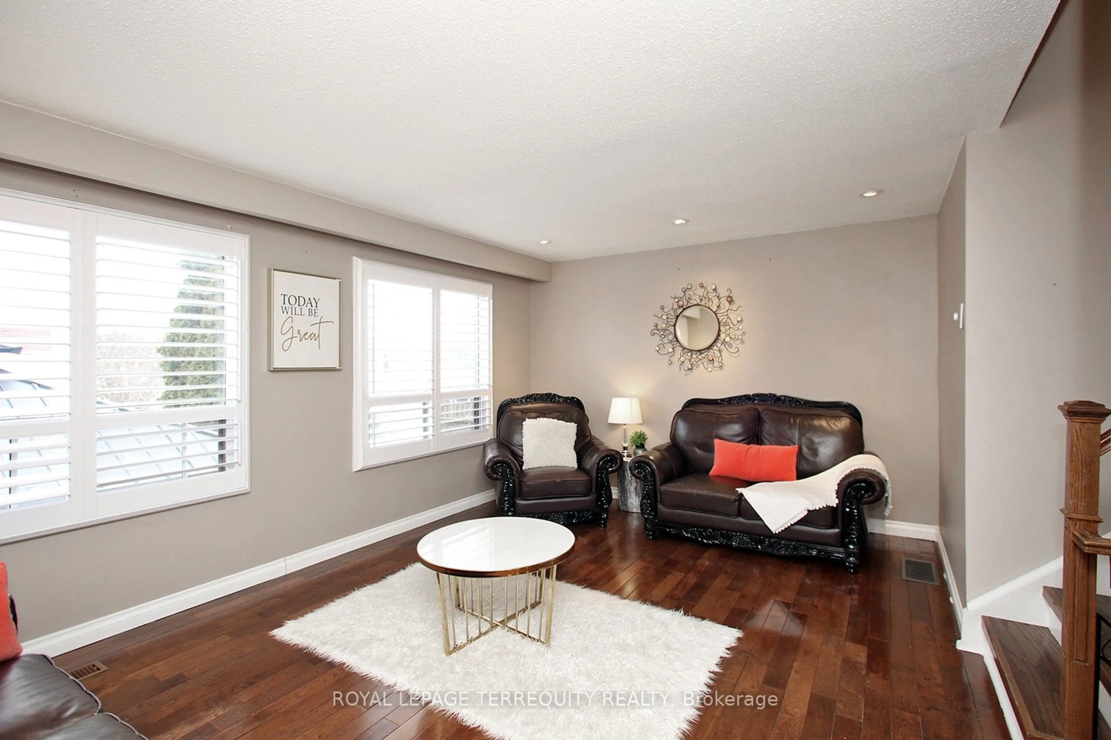 Living room with furniture, wood/laminate floor for 49 Weybridge Tr, Brampton Ontario L6V 3S3