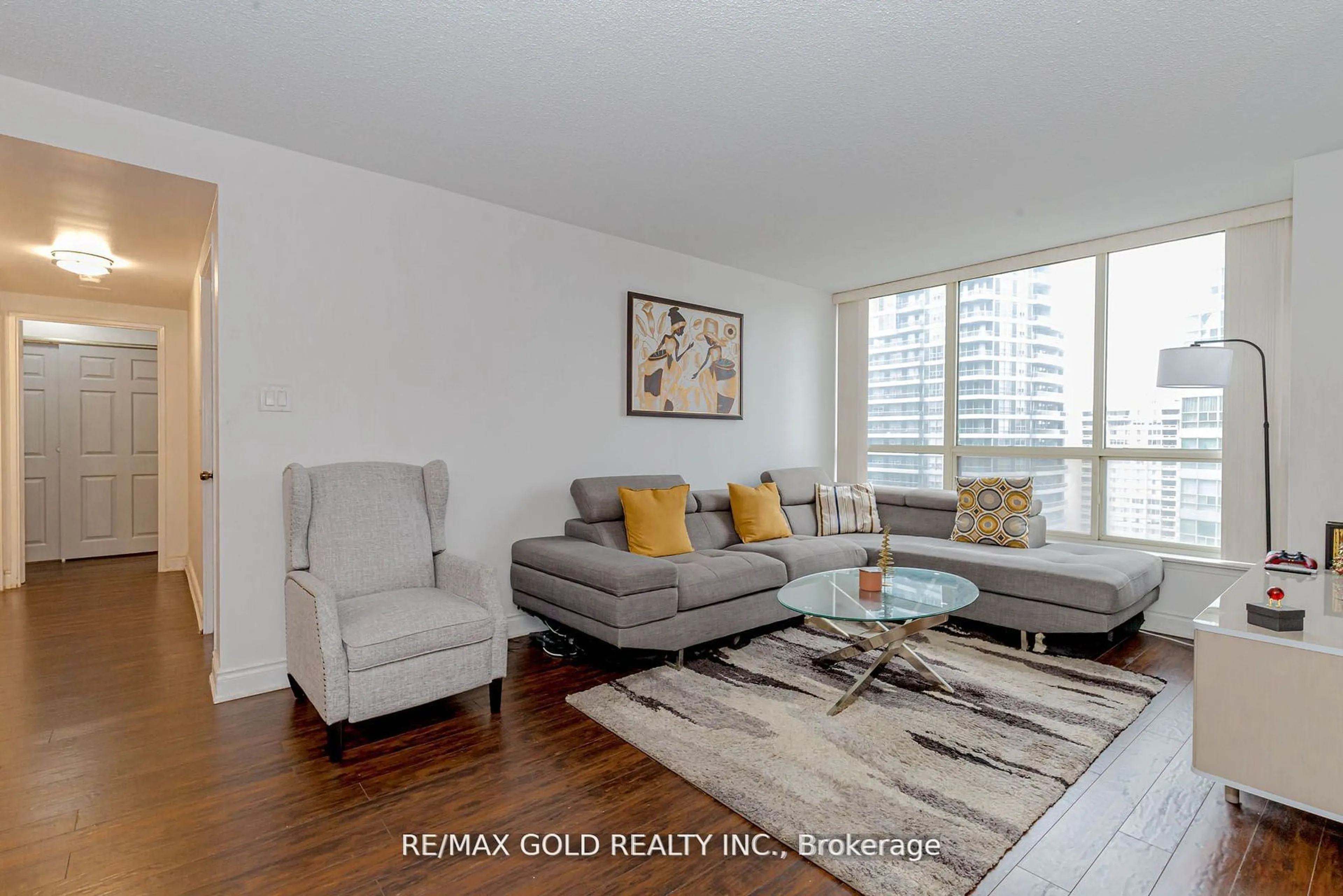 Living room with furniture, wood/laminate floor for 55 Elm Dr #1710, Mississauga Ontario L5B 3Z3