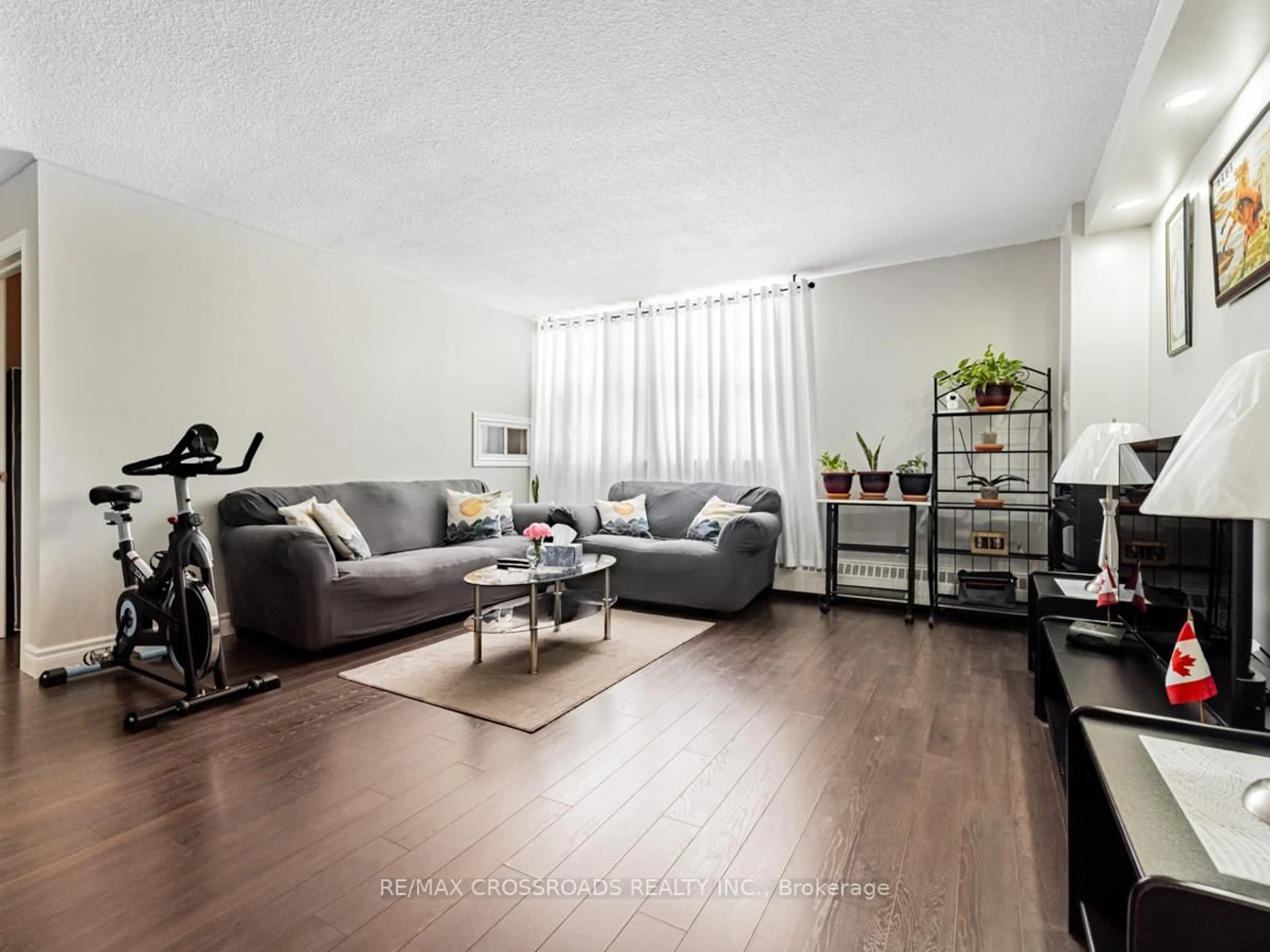 Living room with furniture, wood/laminate floor for 2645 Kipling Ave #101, Toronto Ontario M9V 3S6