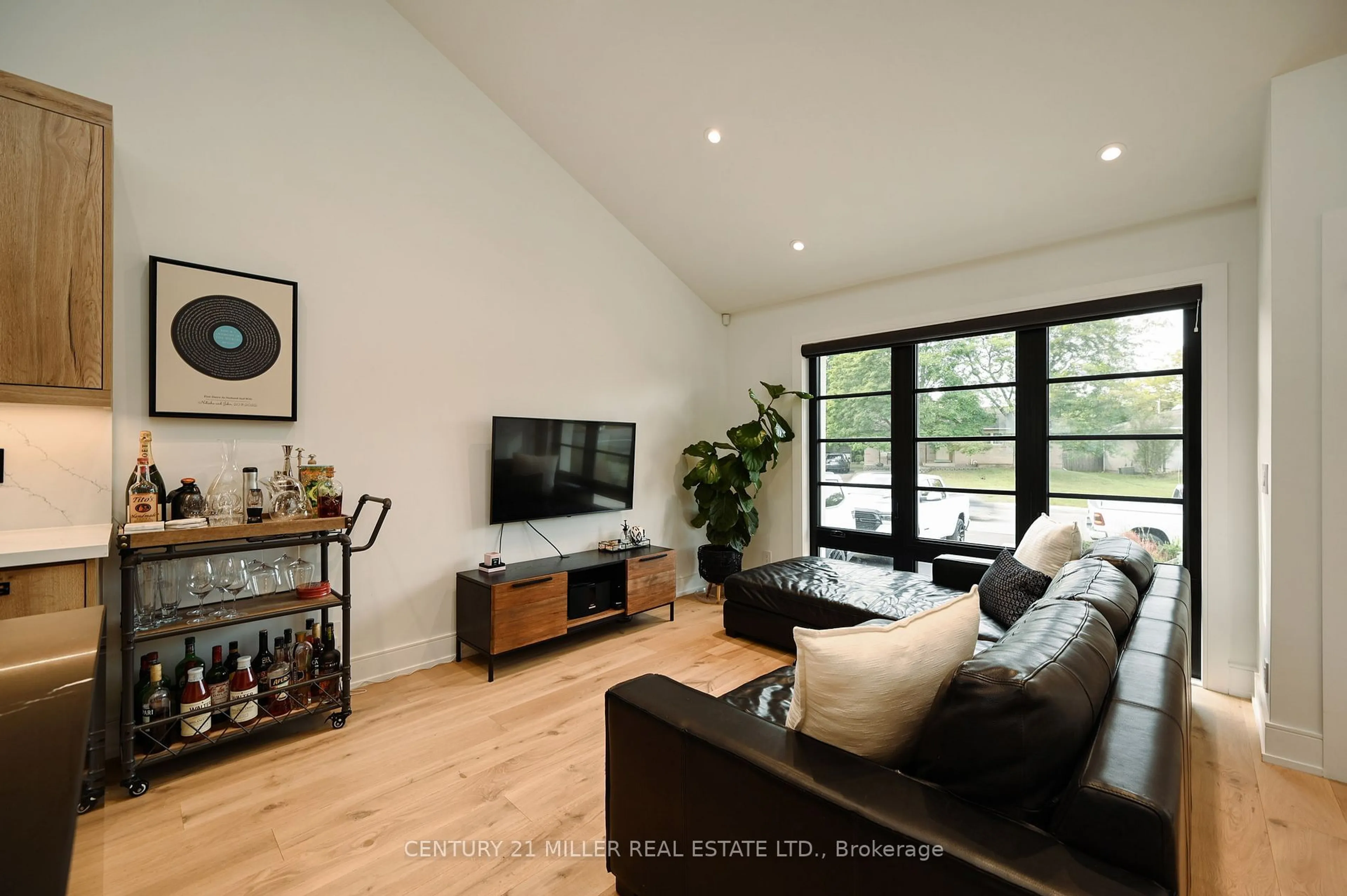 Living room with furniture, wood/laminate floor for 1344 Bridge Rd, Oakville Ontario L6L 2C7