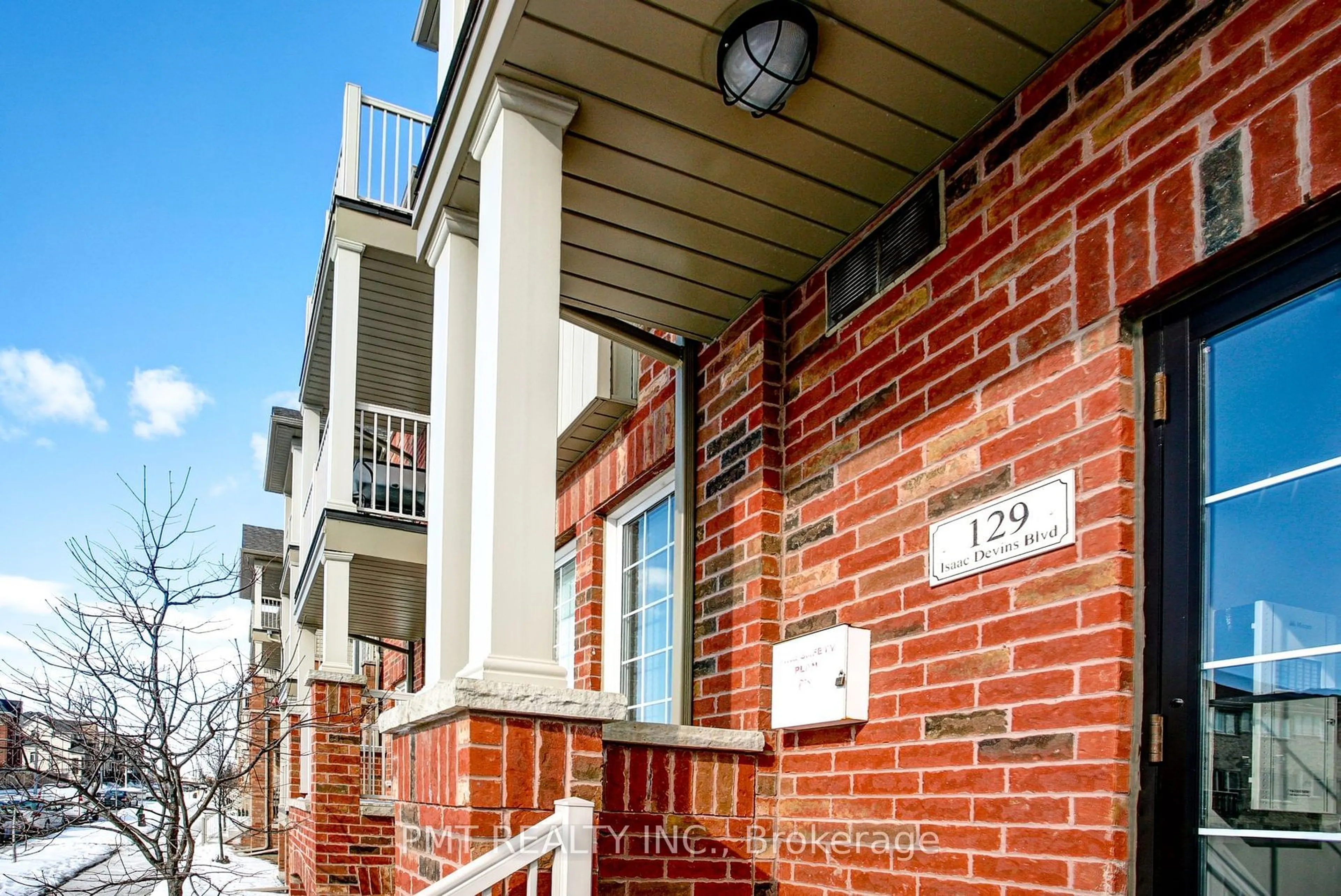 Home with brick exterior material, street for 129 Issac Devins Blvd #7, Toronto Ontario M9M 0C4