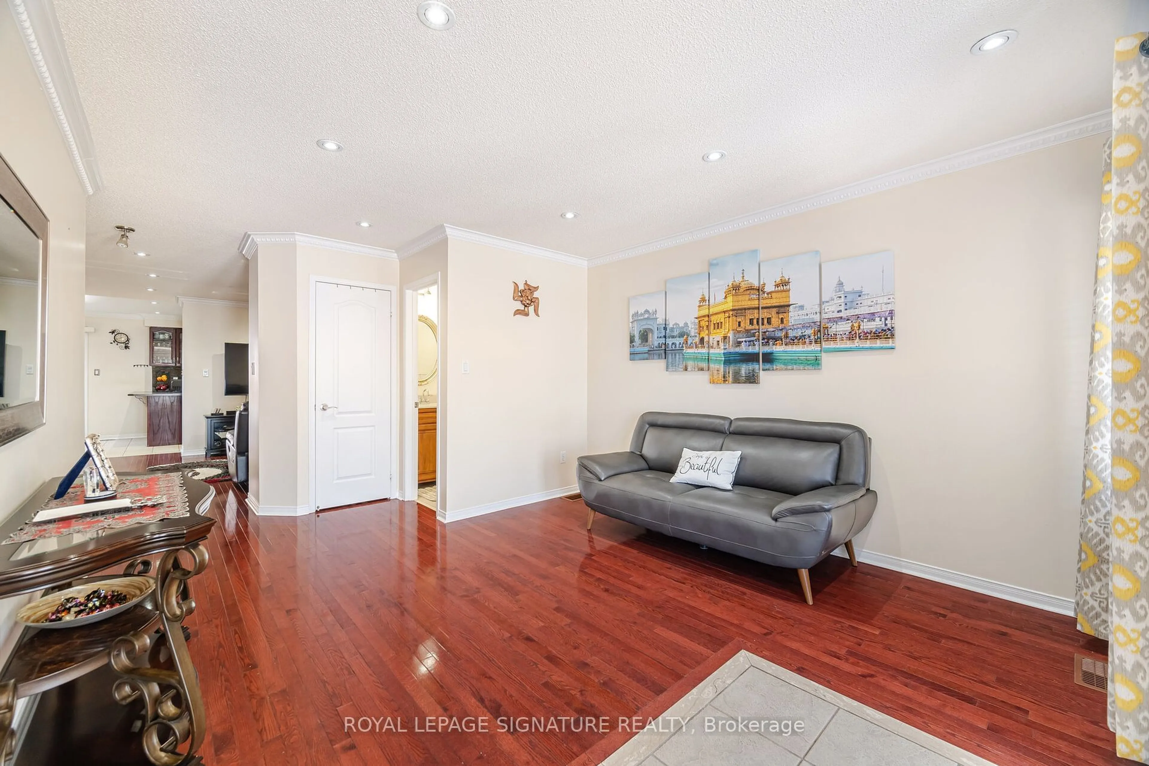 Living room with furniture, wood/laminate floor for 34 Kanata Rd, Brampton Ontario L7A 3R2