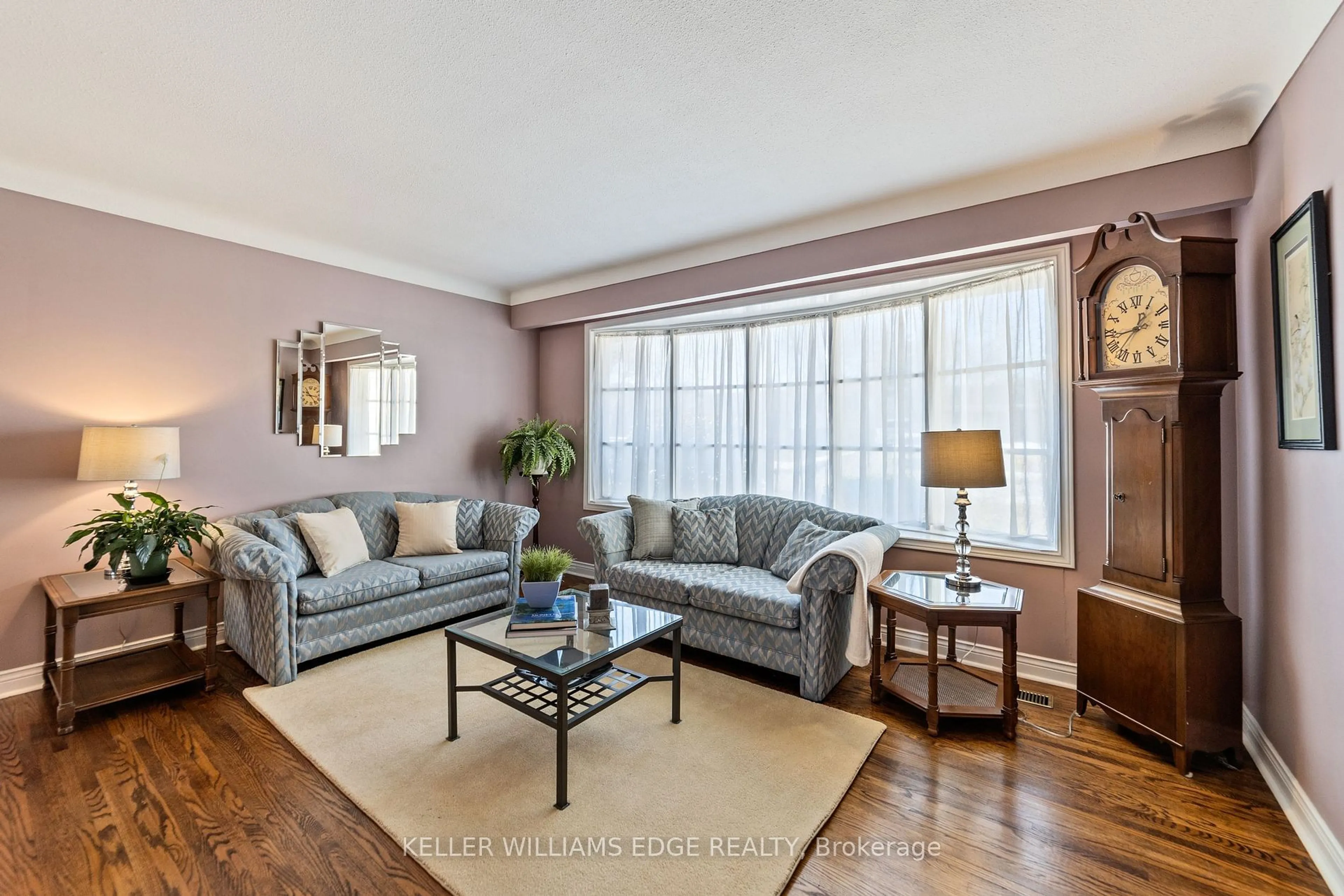 Living room with furniture, wood/laminate floor for 5200 Suncrest Rd, Burlington Ontario L7L 3W8