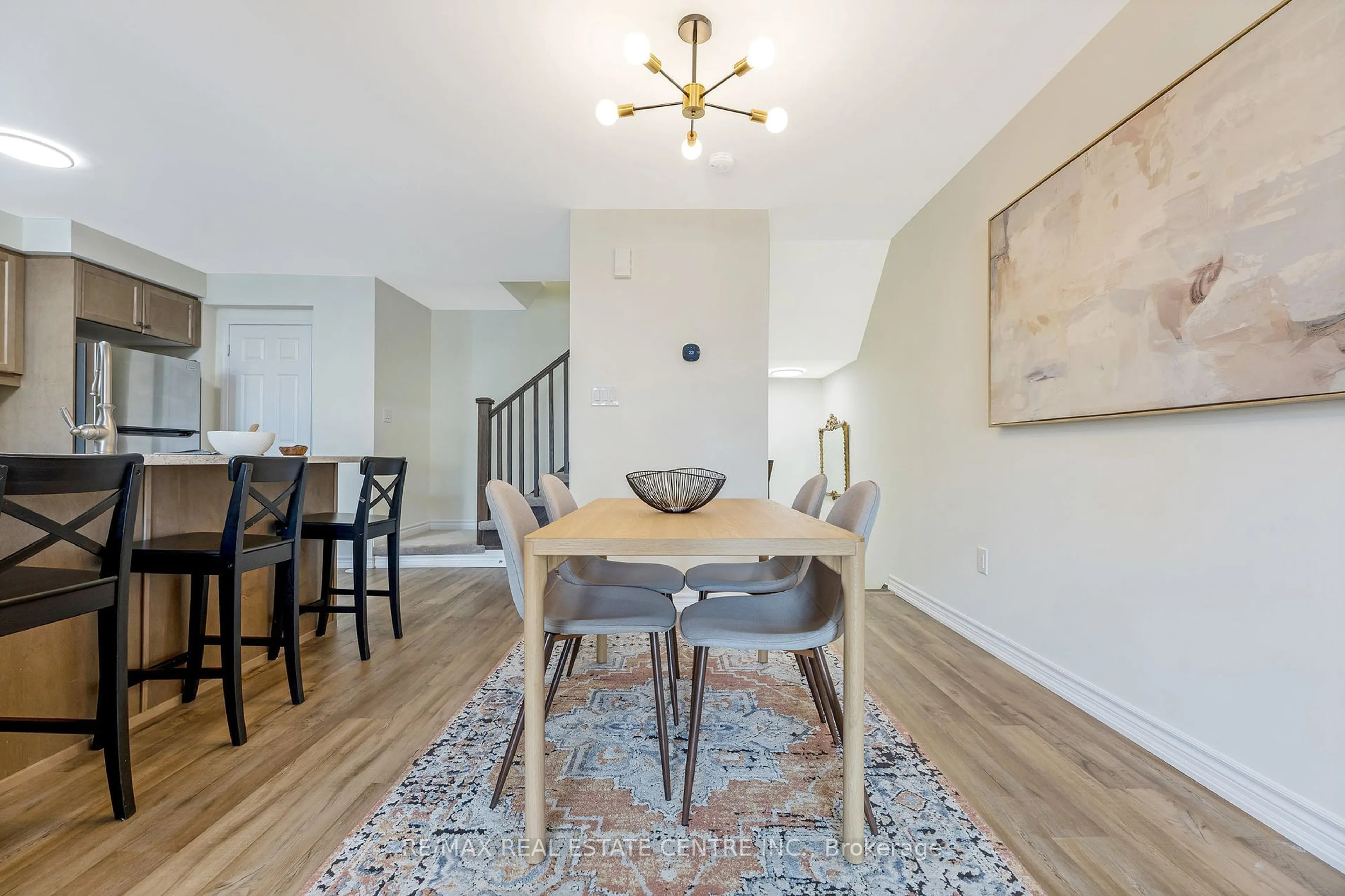 Dining room, wood/laminate floor for 890 Ash Gate, Milton Ontario L9E 1S1