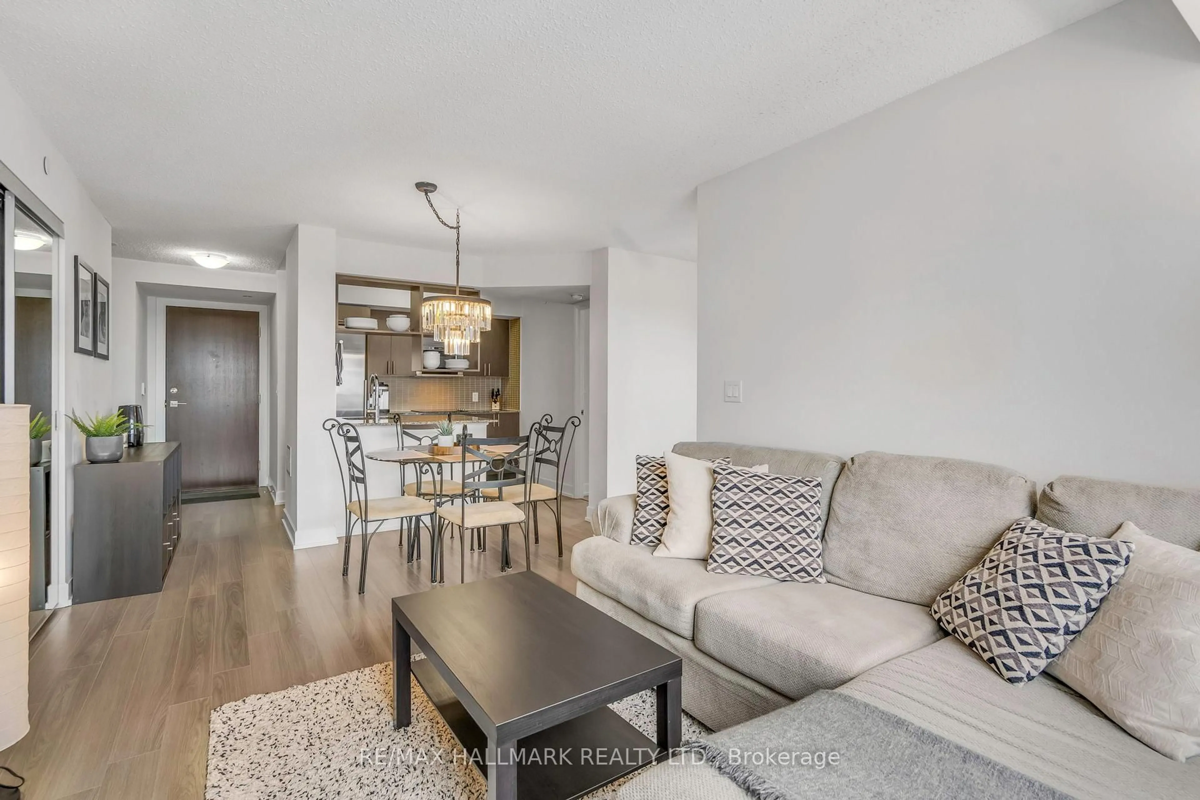 Living room with furniture, wood/laminate floor for 6 Eva Rd #1503, Toronto Ontario M9C 0B1