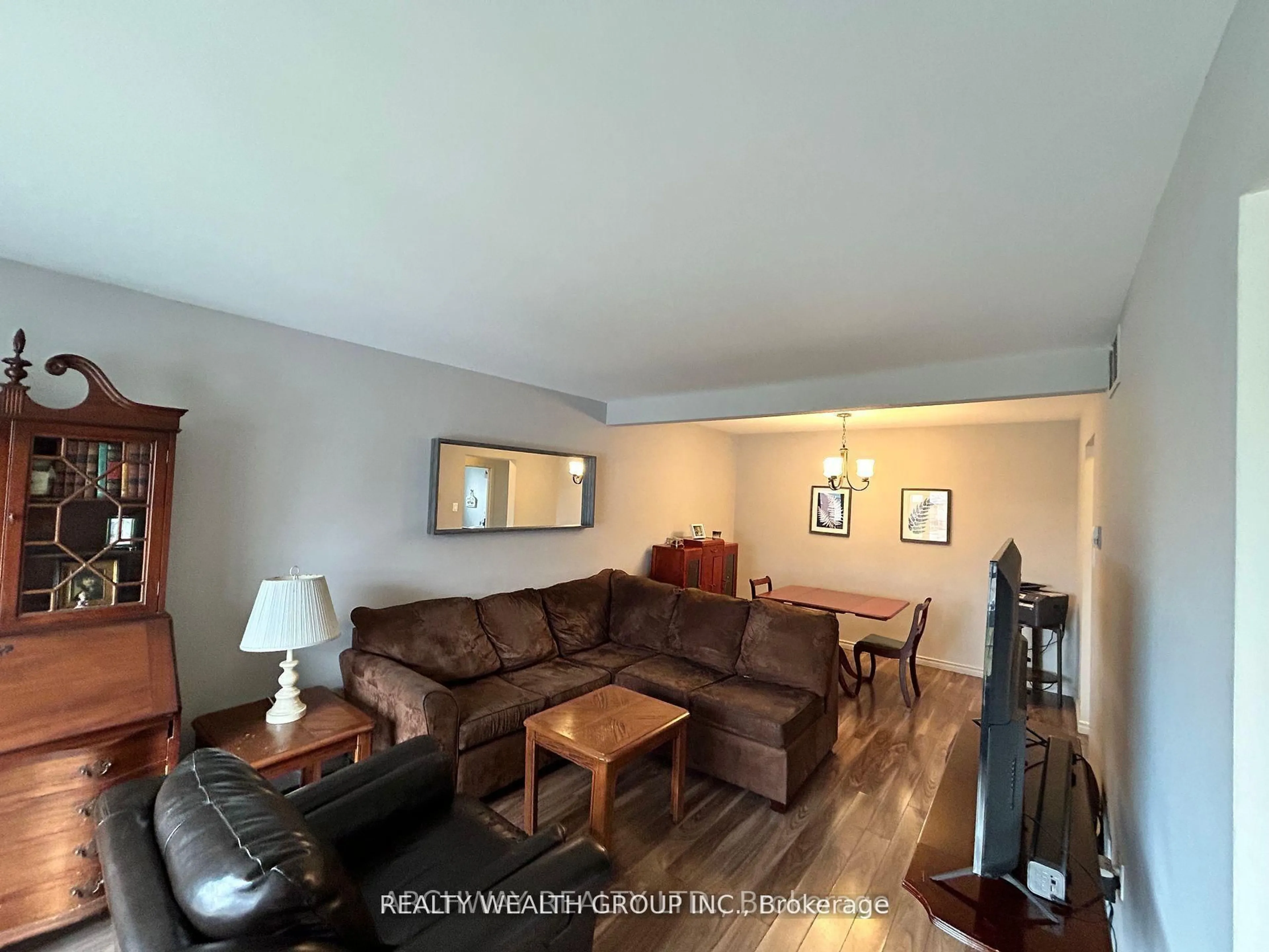 Living room with furniture, wood/laminate floor for 16 Sharon Crt, Brampton Ontario L6W 3B7