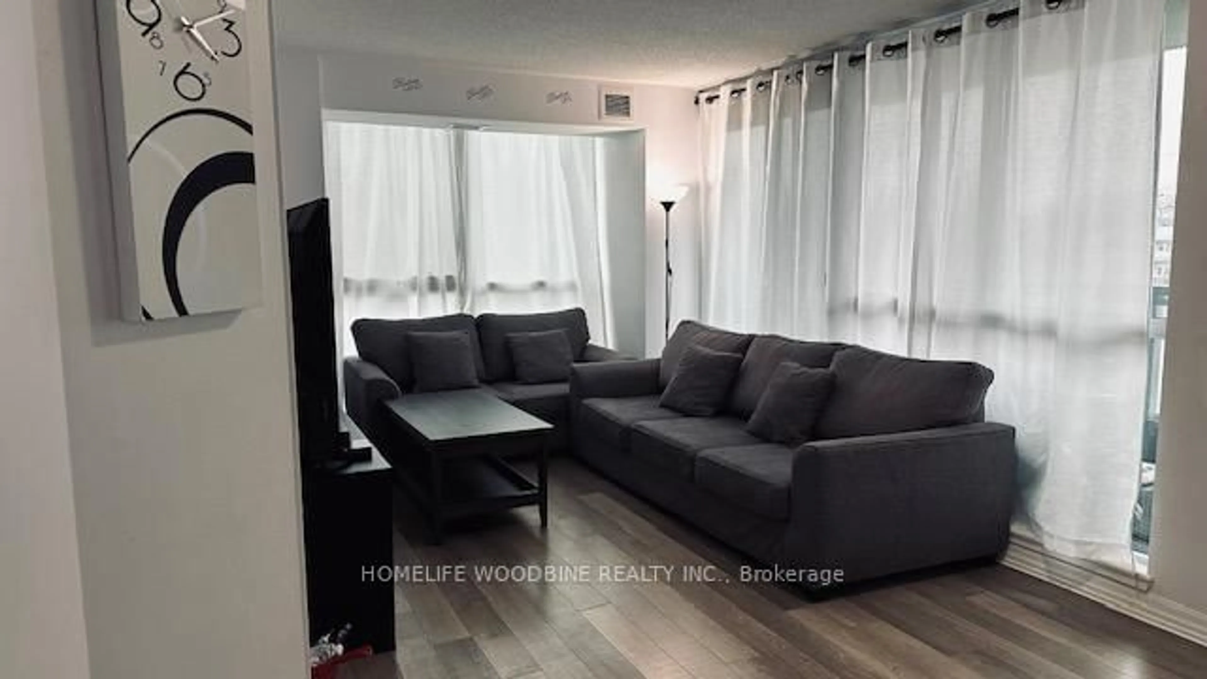 Living room with furniture, wood/laminate floor for 80 Esther Lorrie Dr #312, Toronto Ontario M9W 0C6