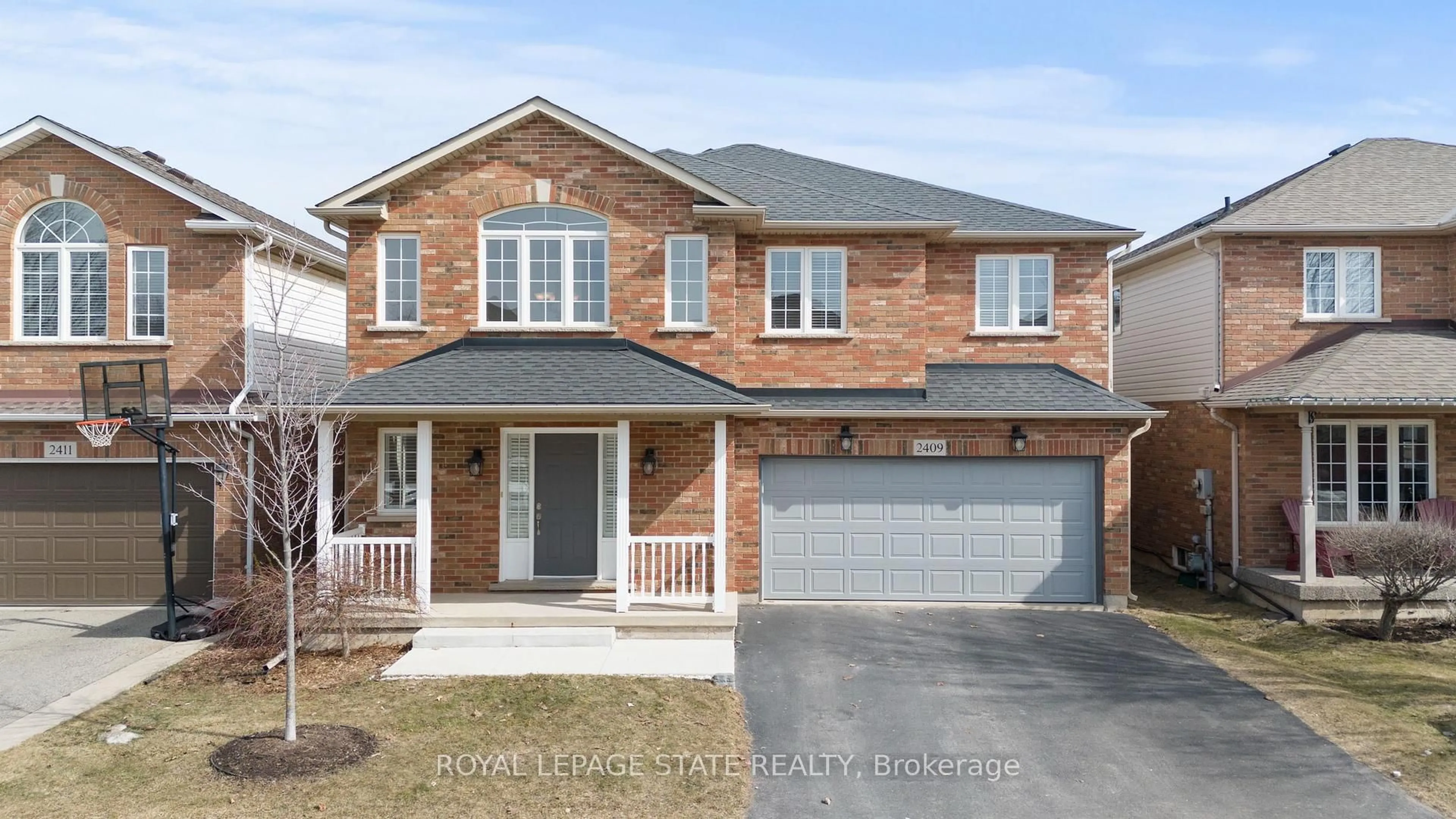 Home with brick exterior material, street for 2409 Norland Dr, Burlington Ontario L7L 6X8