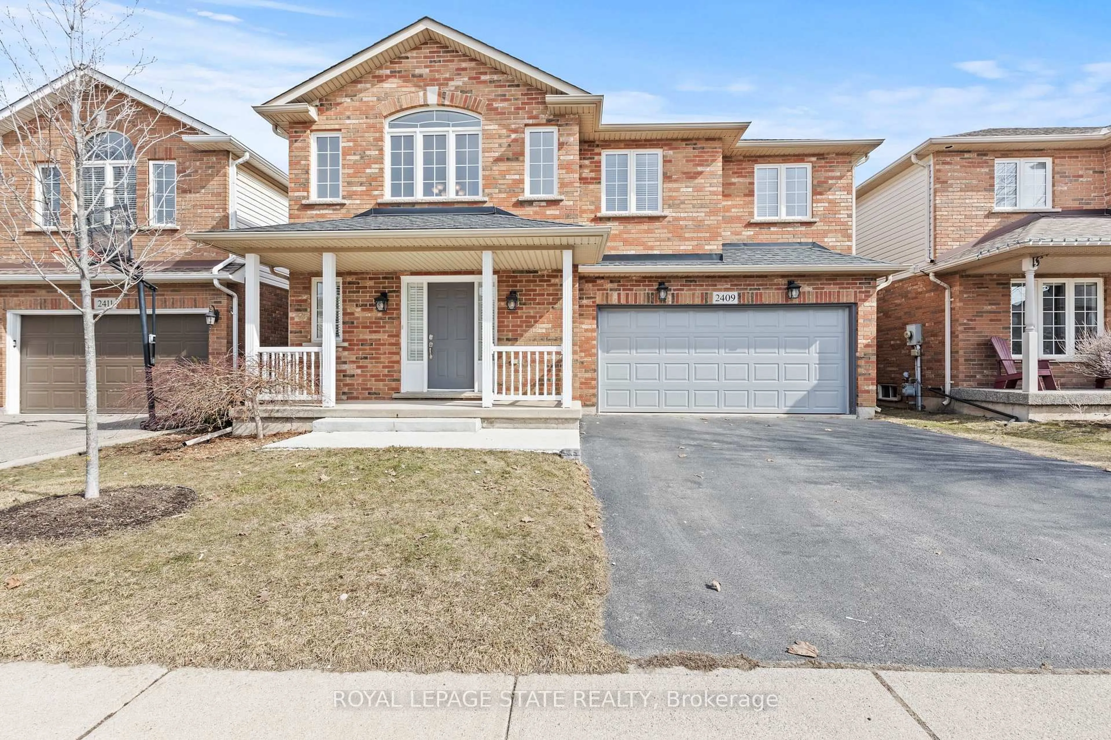 Home with brick exterior material, street for 2409 Norland Dr, Burlington Ontario L7L 6X8