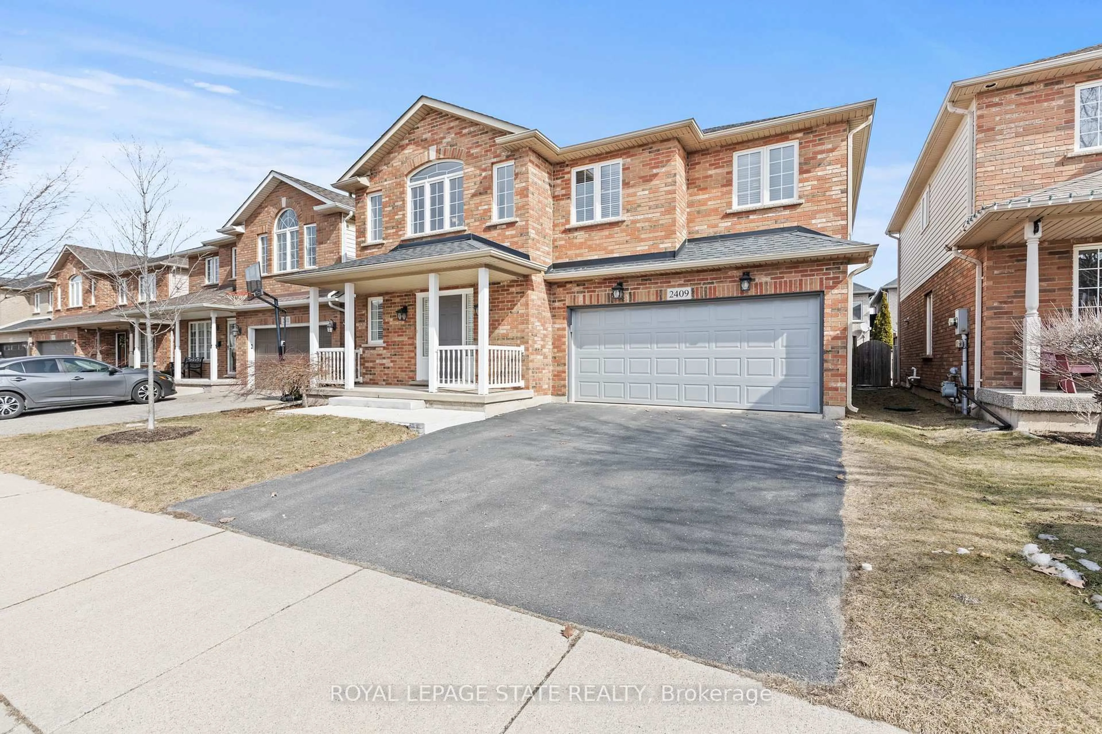 Home with brick exterior material, street for 2409 Norland Dr, Burlington Ontario L7L 6X8