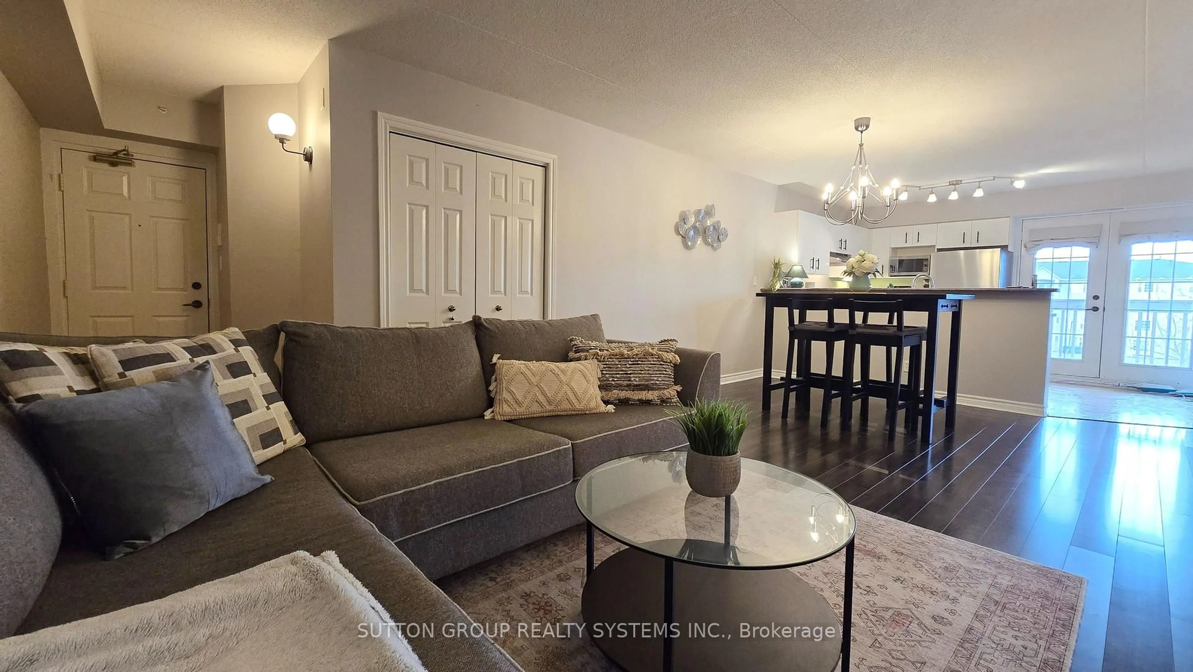 Living room with furniture, wood/laminate floor for 4005 Kilmer Dr #301, Burlington Ontario L7M 4M2