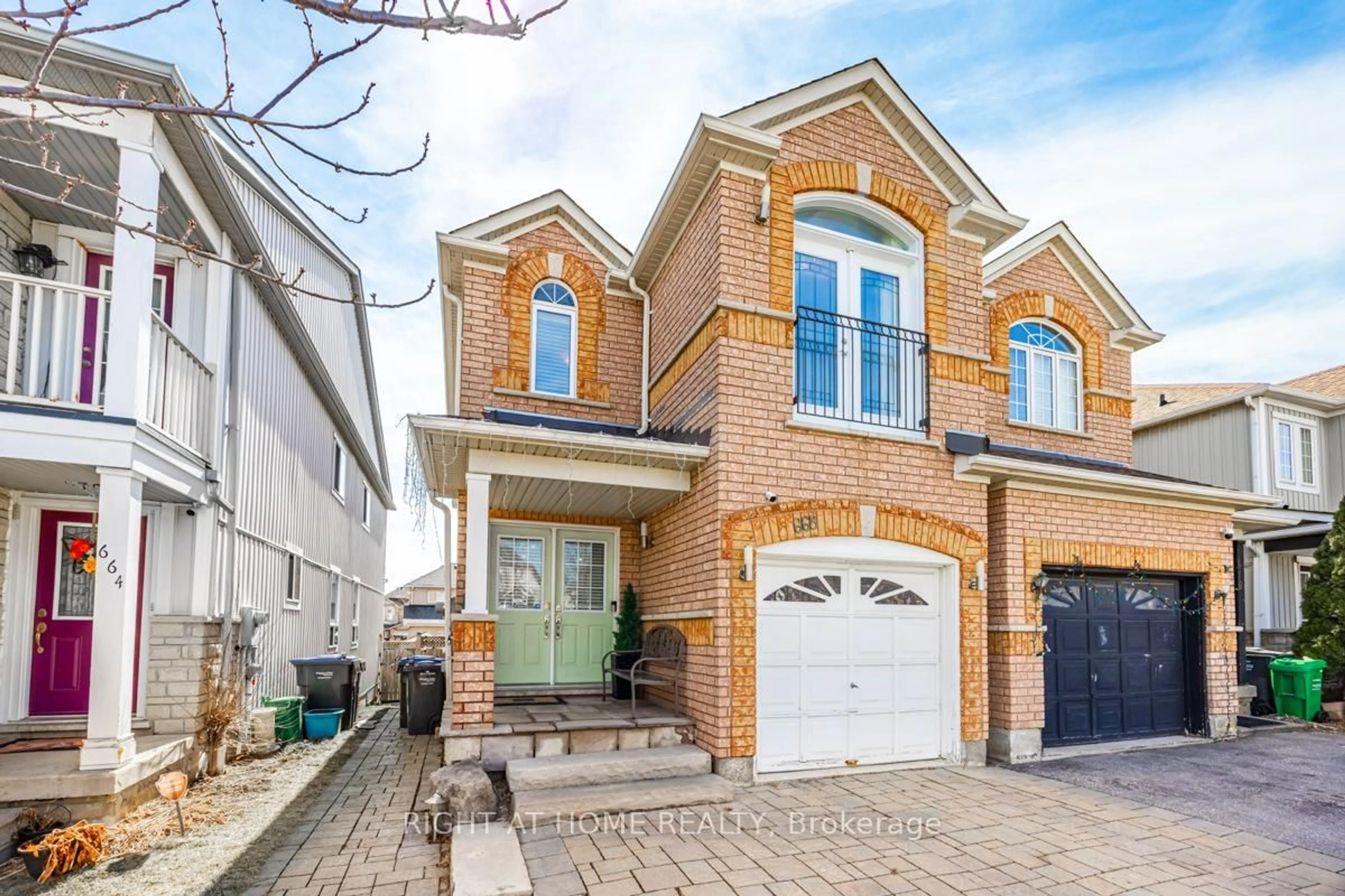 Home with brick exterior material, street for 668 Rossellini Dr, Mississauga Ontario L5W 1L1