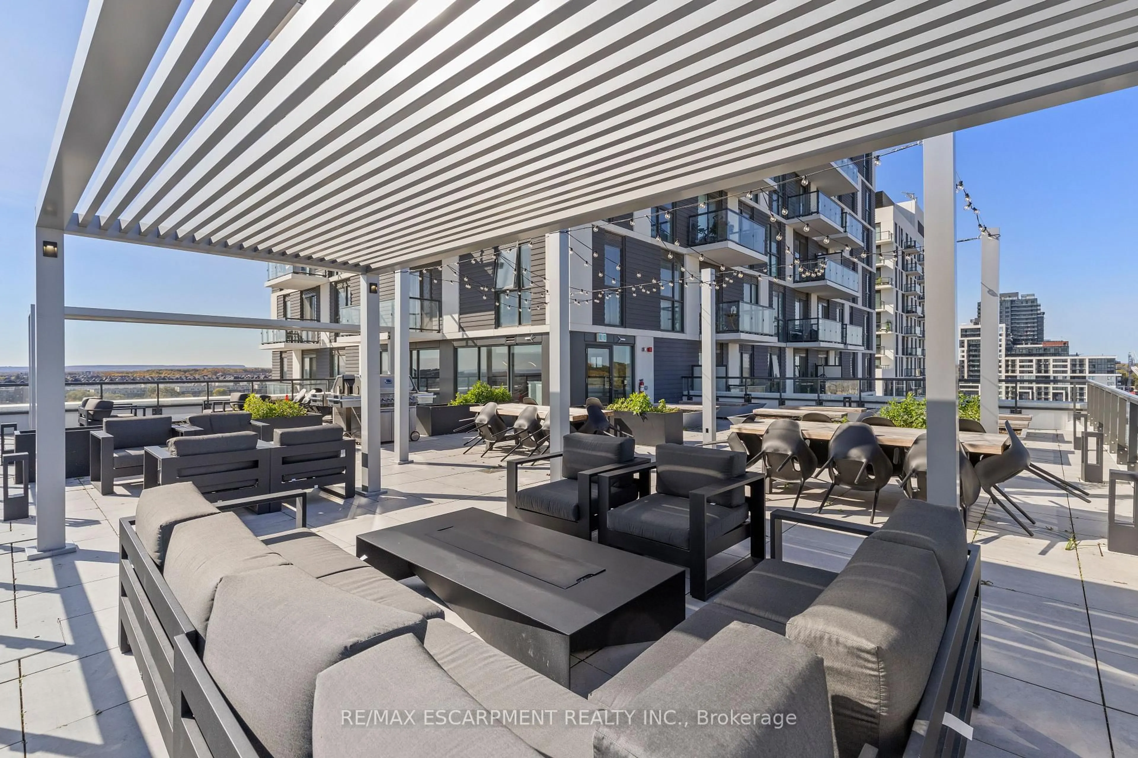 Patio, city buildings view from balcony for 335 Wheat Boom Dr #418, Oakville Ontario L6H 7Y1