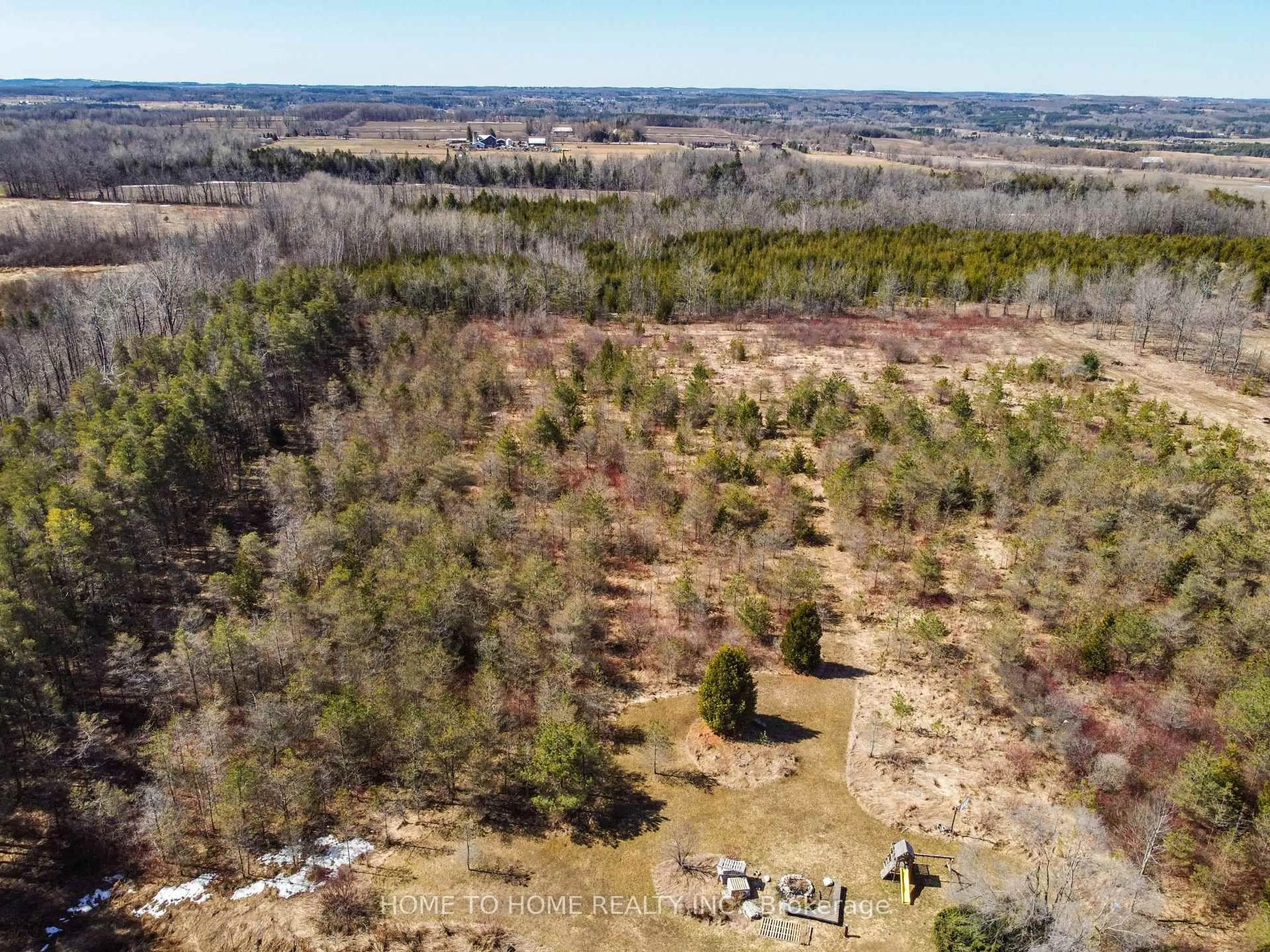 A pic from outside/outdoor area/front of a property/back of a property/a pic from drone, forest/trees view for 19690 Hurontario St, Caledon Ontario L7K 1W7
