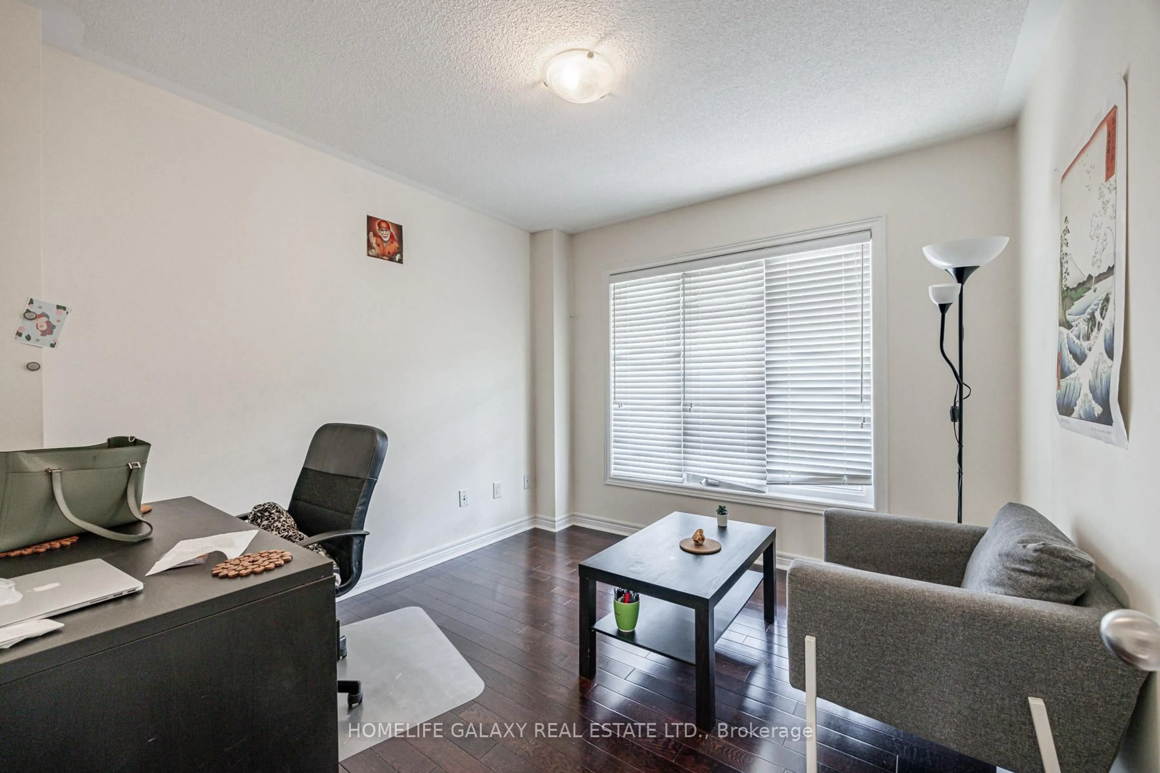 Living room with furniture, wood/laminate floor for 12 Snapdragon Sq, Brampton Ontario L6P 3K4