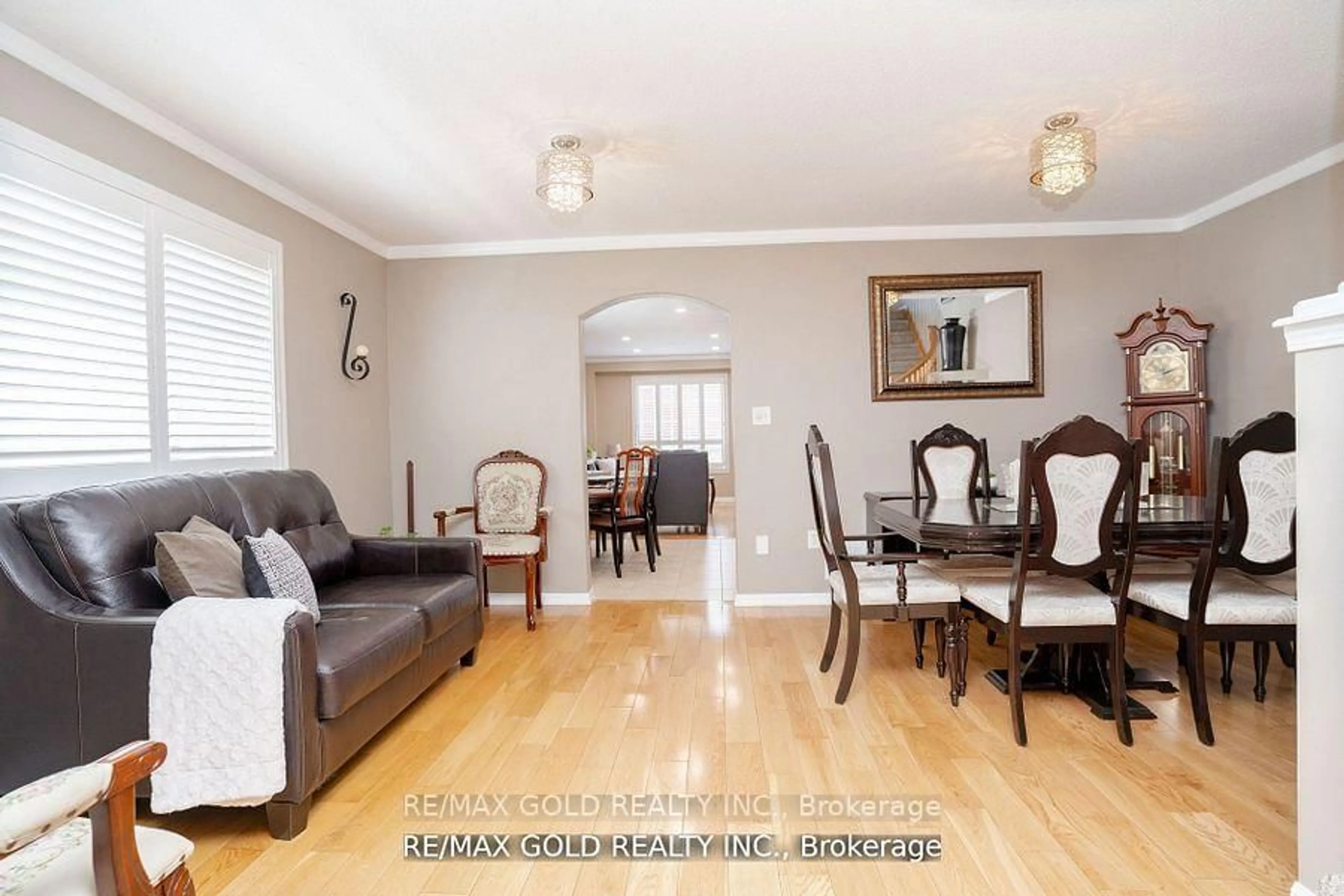 Living room with furniture, wood/laminate floor for 34 Jingle Cres, Brampton Ontario L6S 0B2