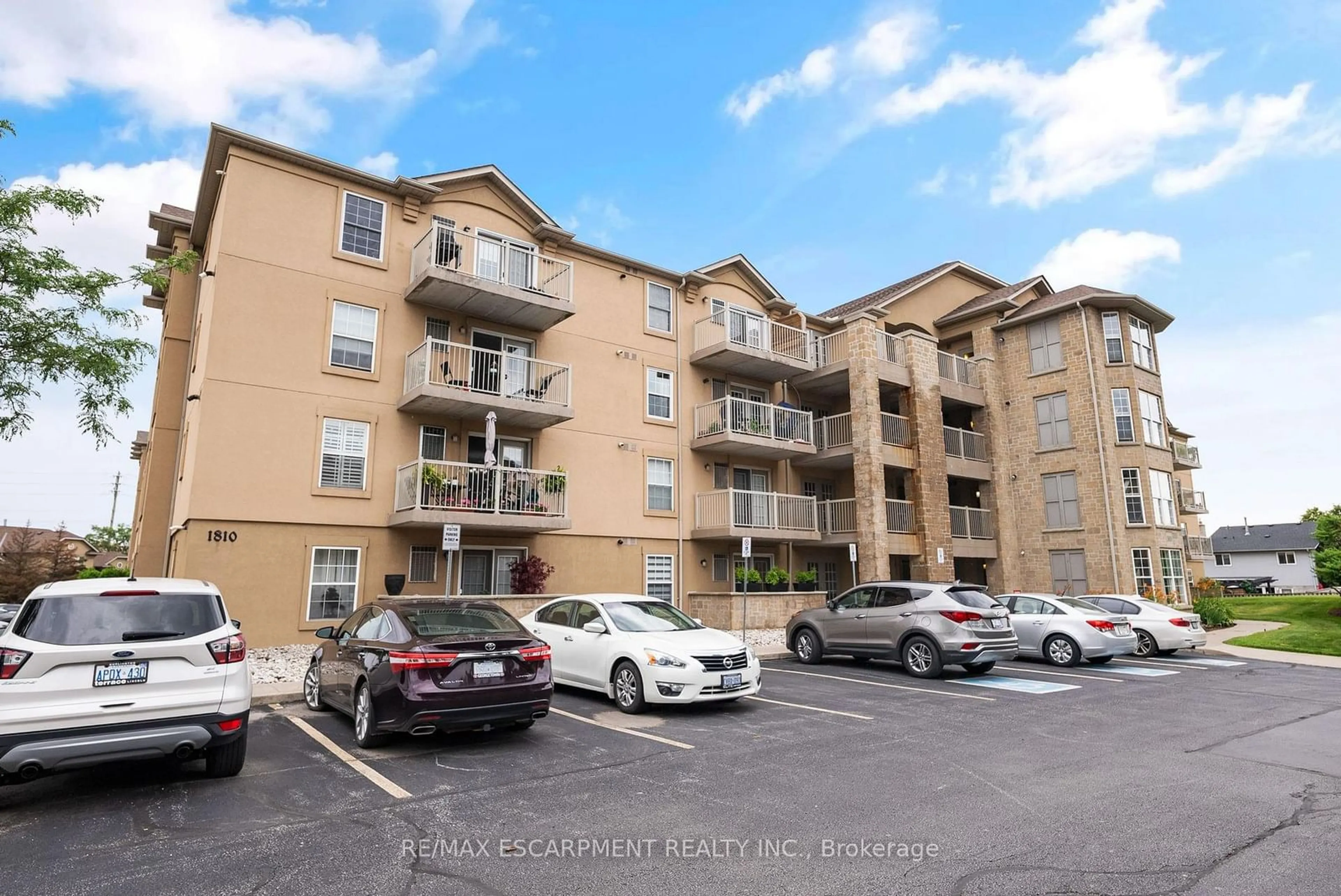A pic from outside/outdoor area/front of a property/back of a property/a pic from drone, unknown for 1810 Walker's Line #204, Burlington Ontario L7M 4V3