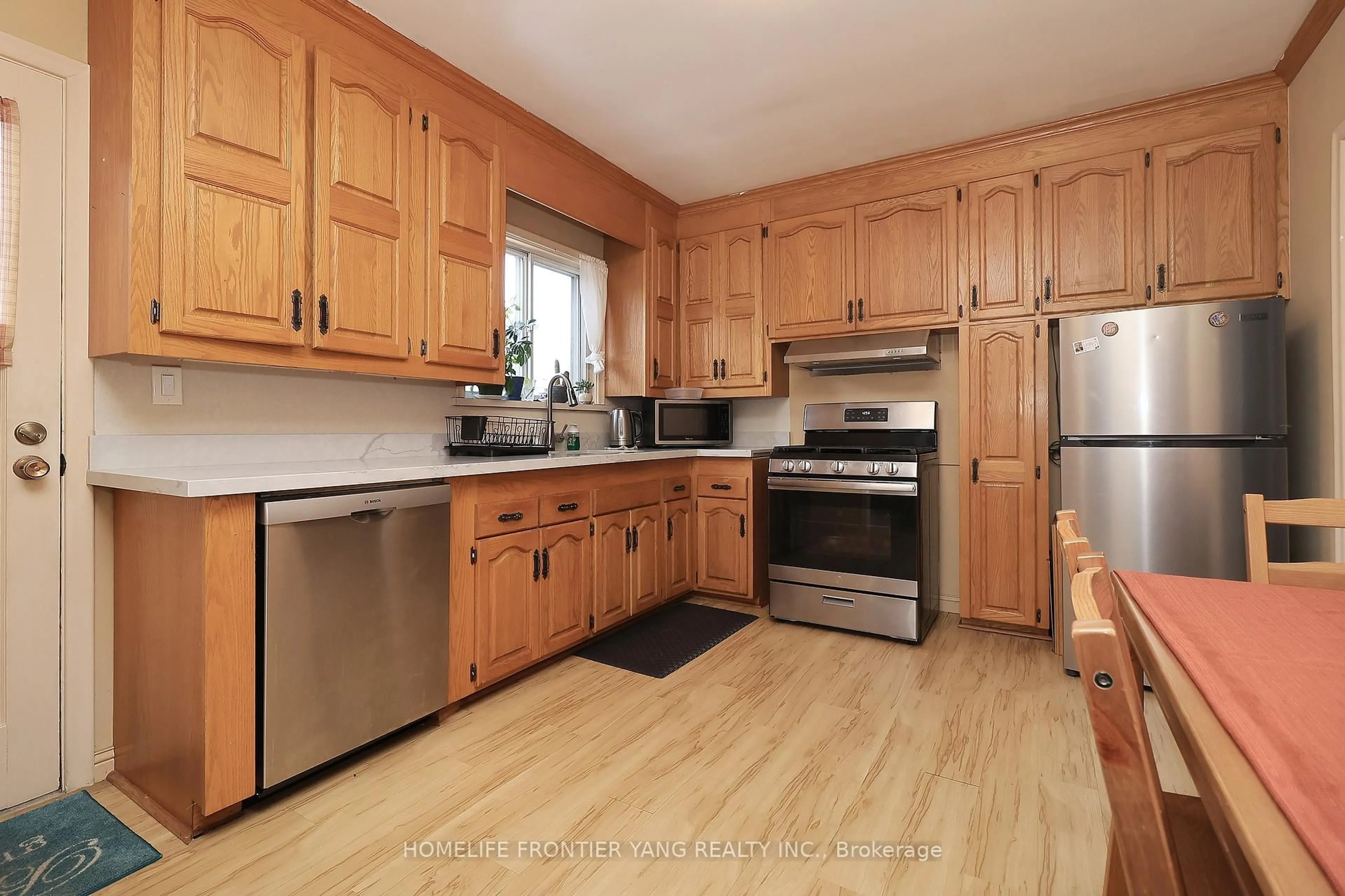 Standard kitchen, wood/laminate floor for 2 Snowellen Ave, Toronto Ontario M9C 1H9