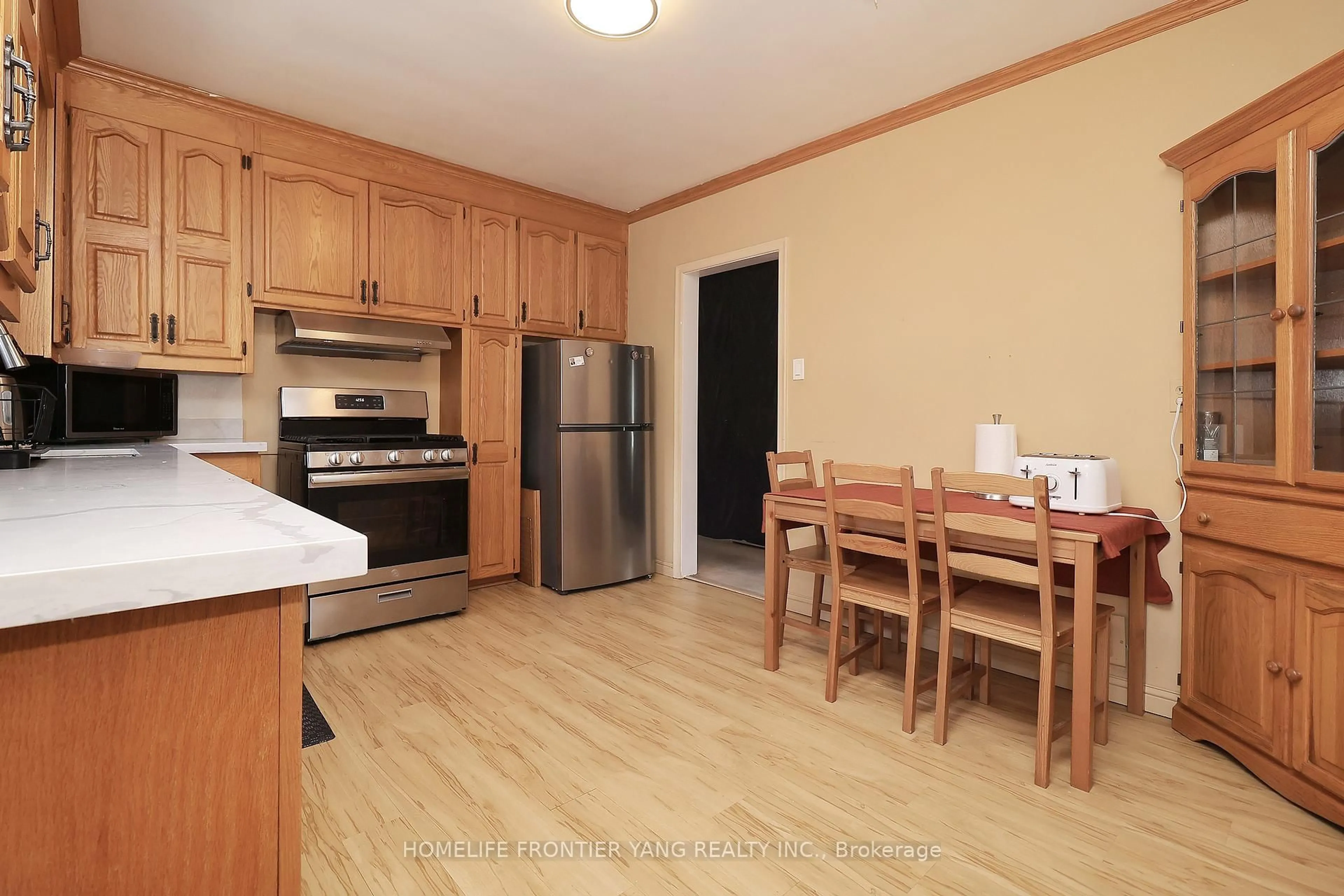 Standard kitchen, wood/laminate floor for 2 Snowellen Ave, Toronto Ontario M9C 1H9