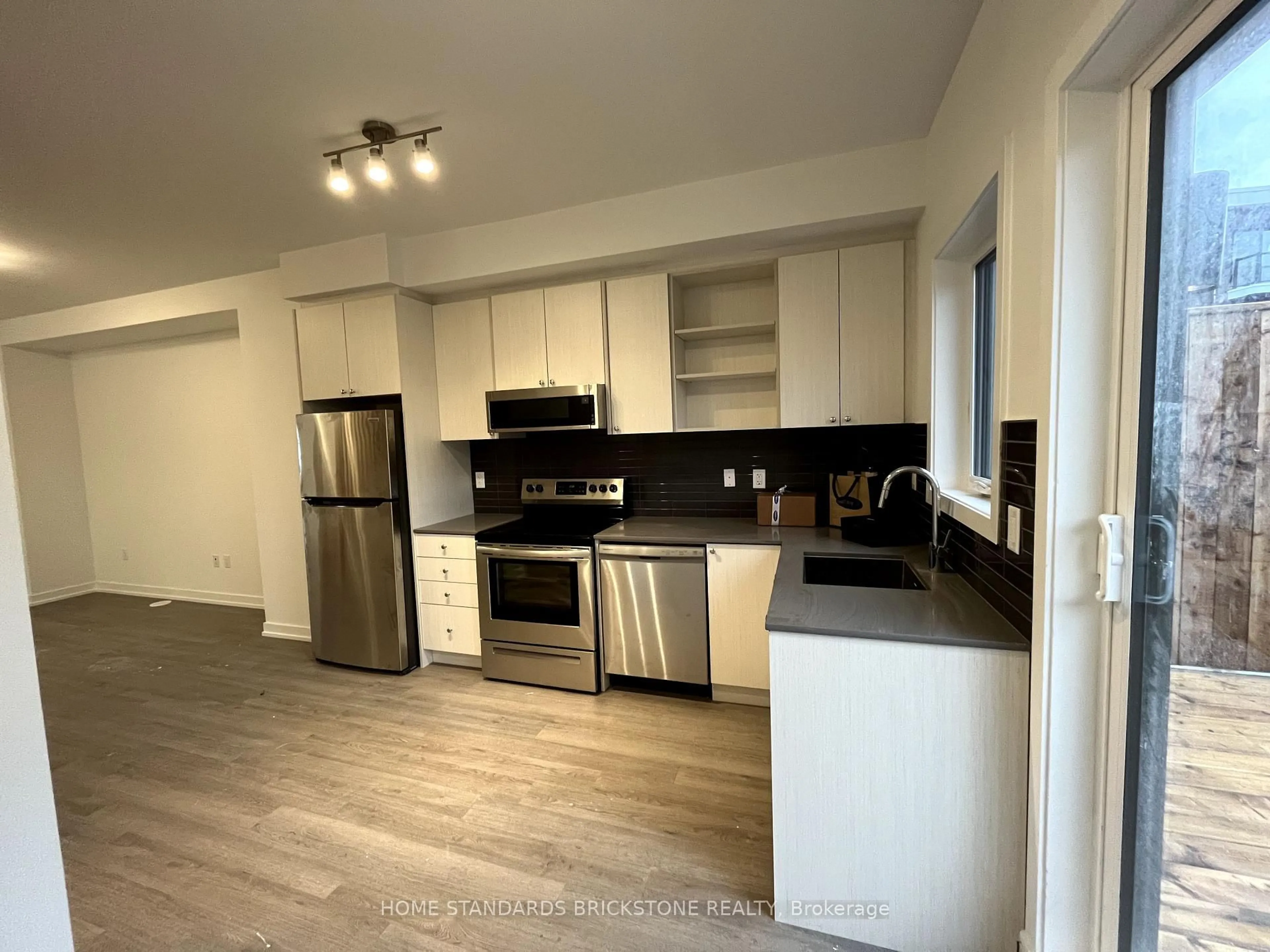 Open concept kitchen, wood/laminate floor for 183 Downsview Park Blvd, Toronto Ontario M3K 0C8