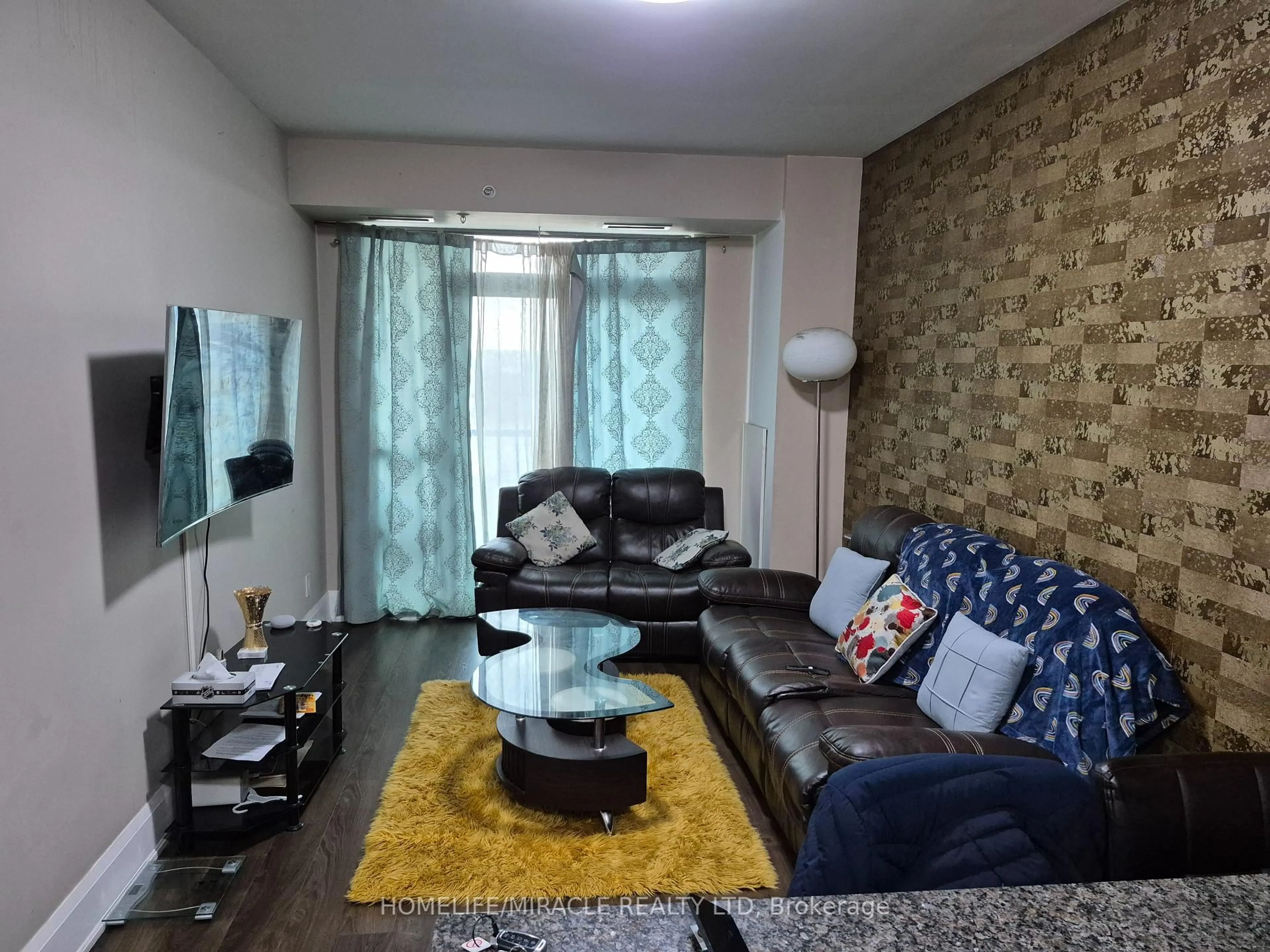 Living room with furniture, unknown for 45 Yorkland Blvd #209, Brampton Ontario L6P 4B4