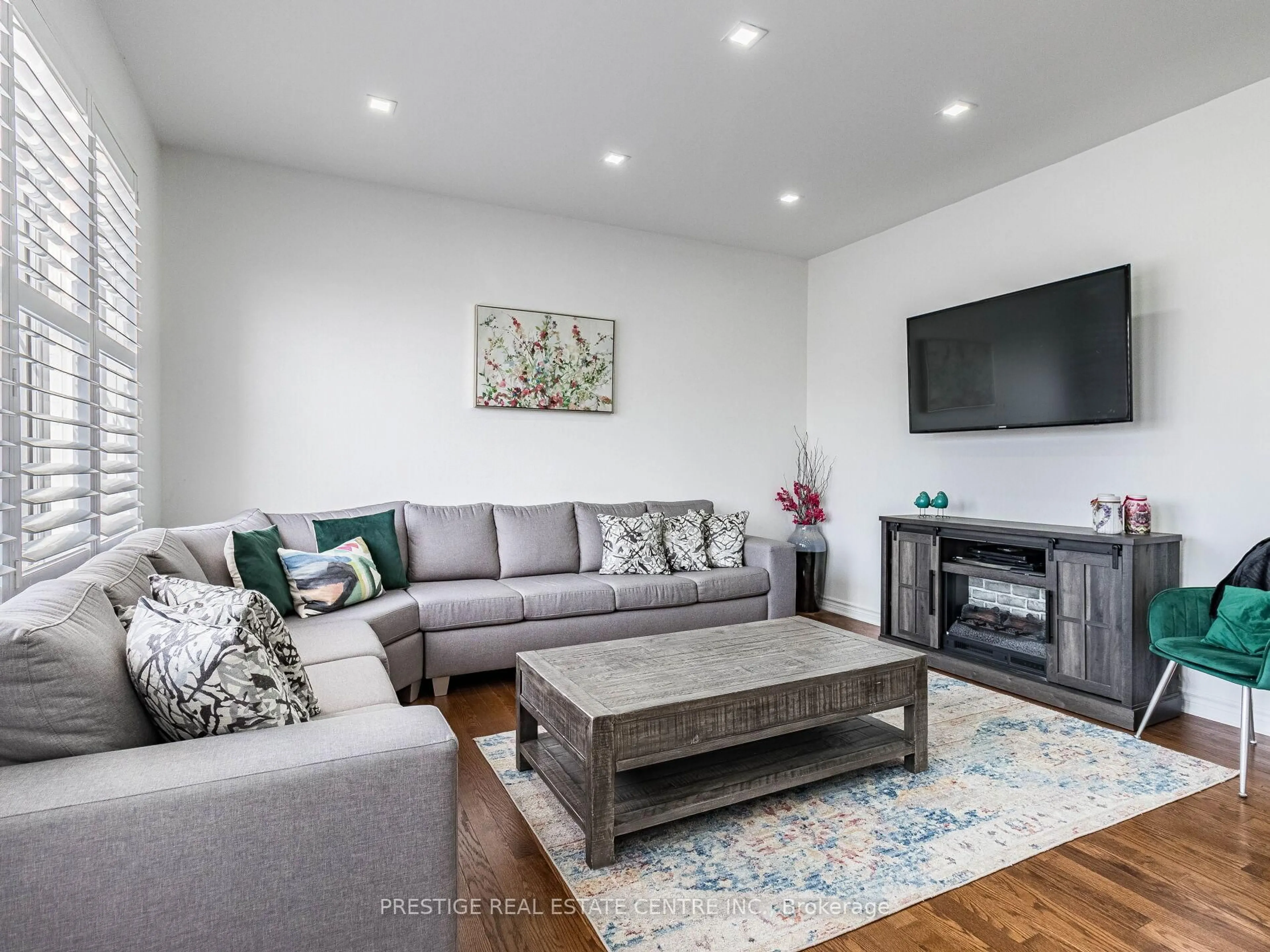 Living room with furniture, wood/laminate floor for 1550 Clitherow St, Milton Ontario L9E 0A5
