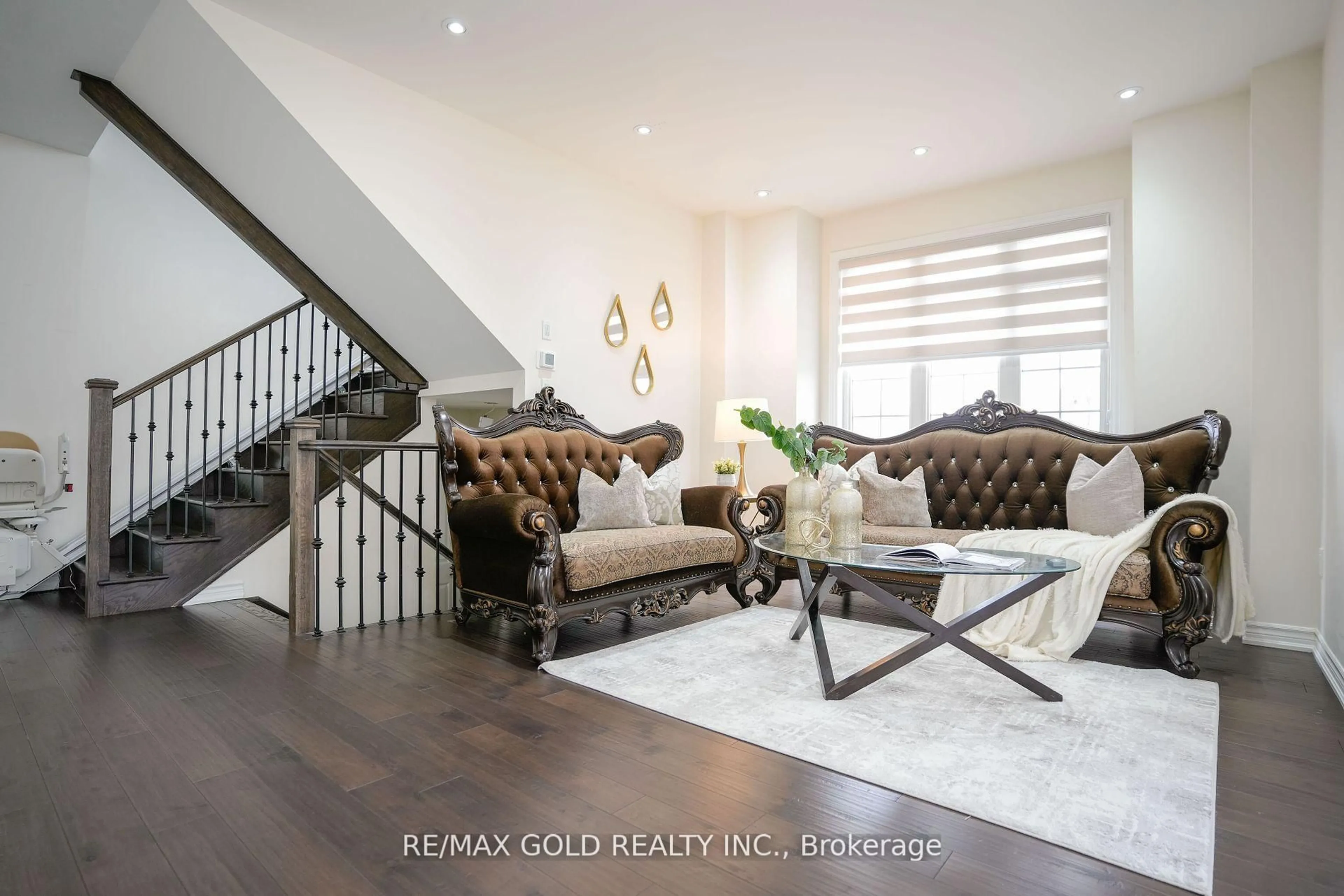 Living room with furniture, wood/laminate floor for 1 Goodview Dr, Brampton Ontario L6R 4C5