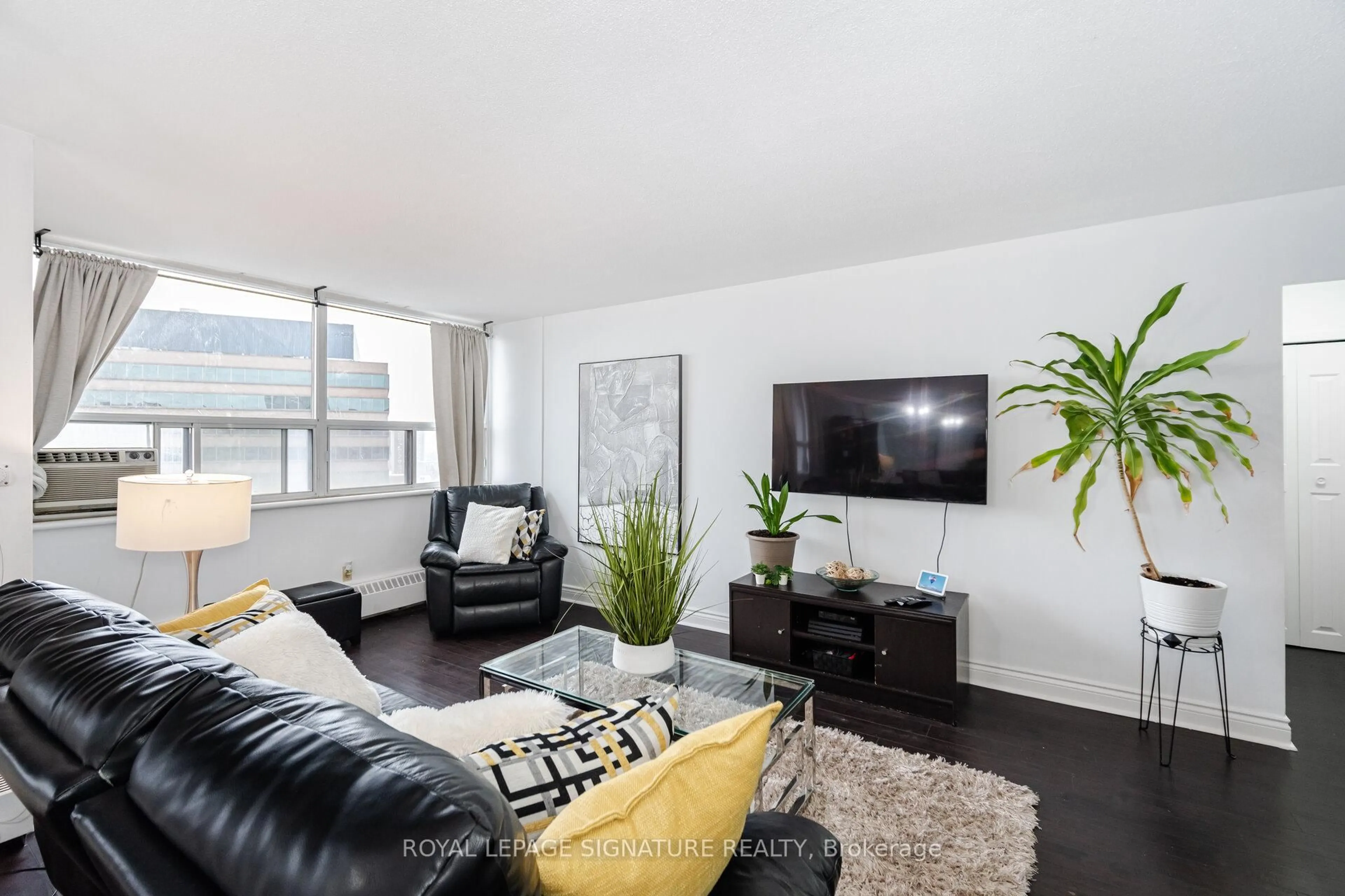 Living room with furniture, wood/laminate floor for 451 The West Mall Dr #1212, Toronto Ontario M9C 1G1