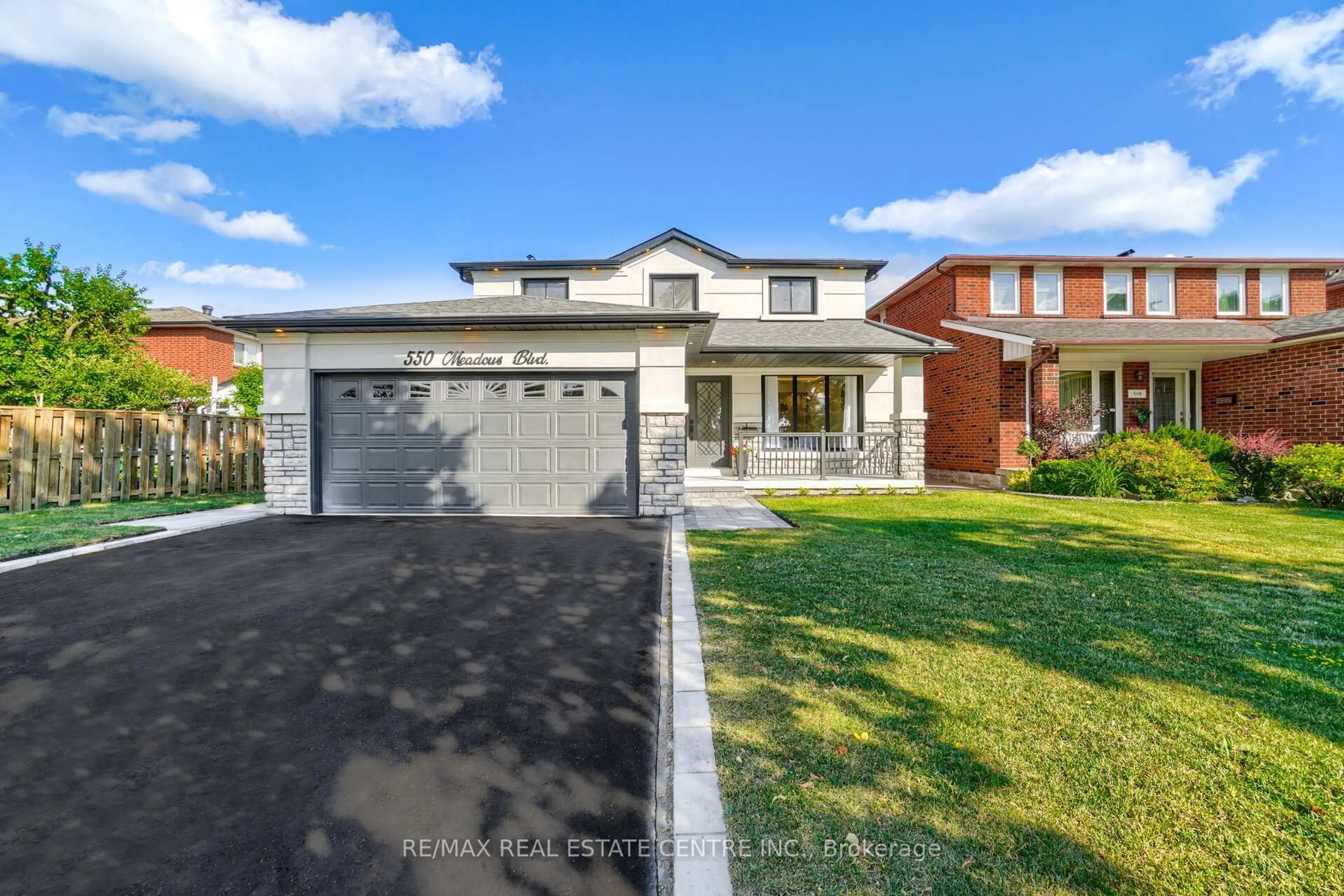 Home with brick exterior material, street for 550 Meadows Blvd, Mississauga Ontario L4Z 1G6