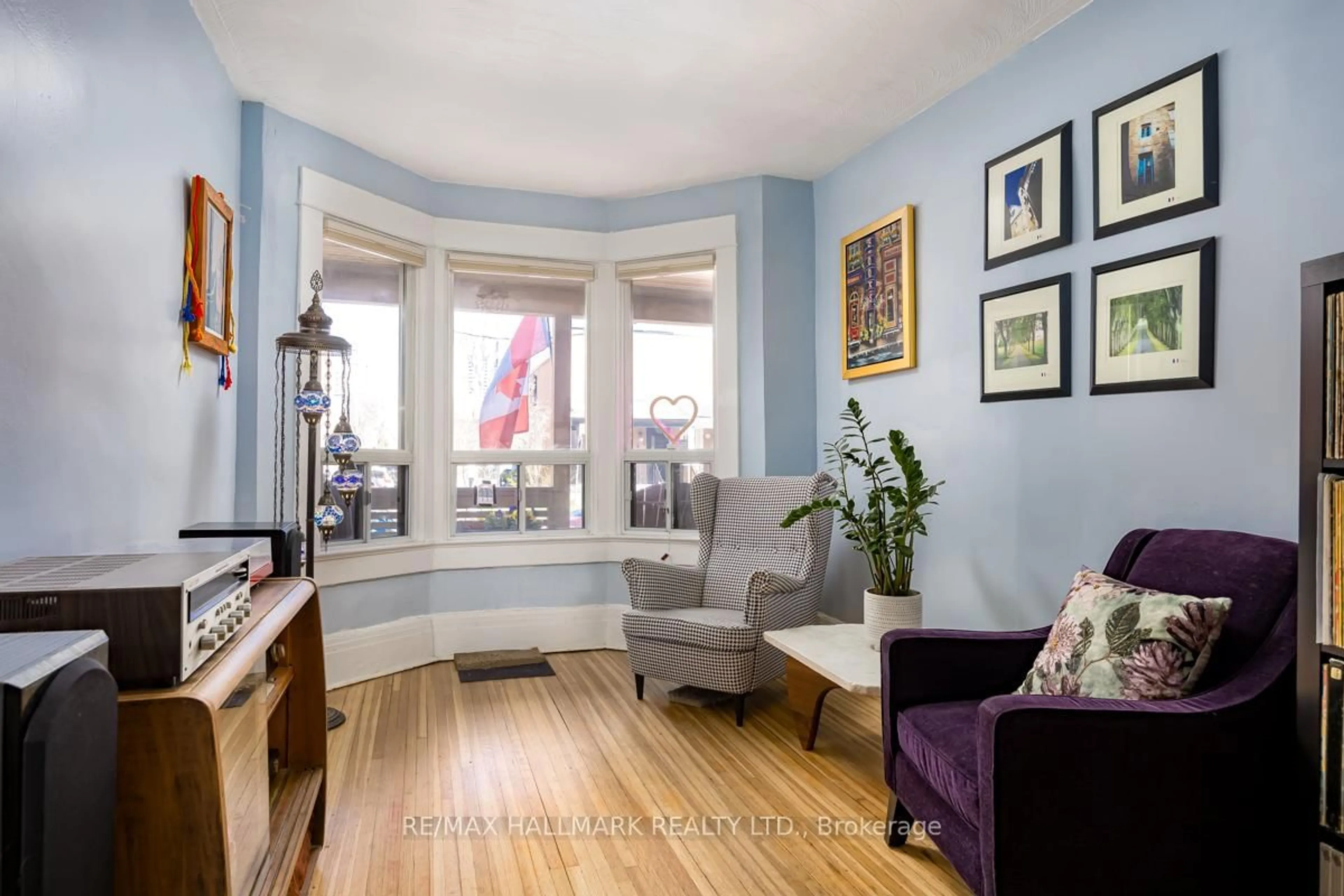 Living room with furniture, wood/laminate floor for 223 Wallace Ave, Toronto Ontario M6H 1V5