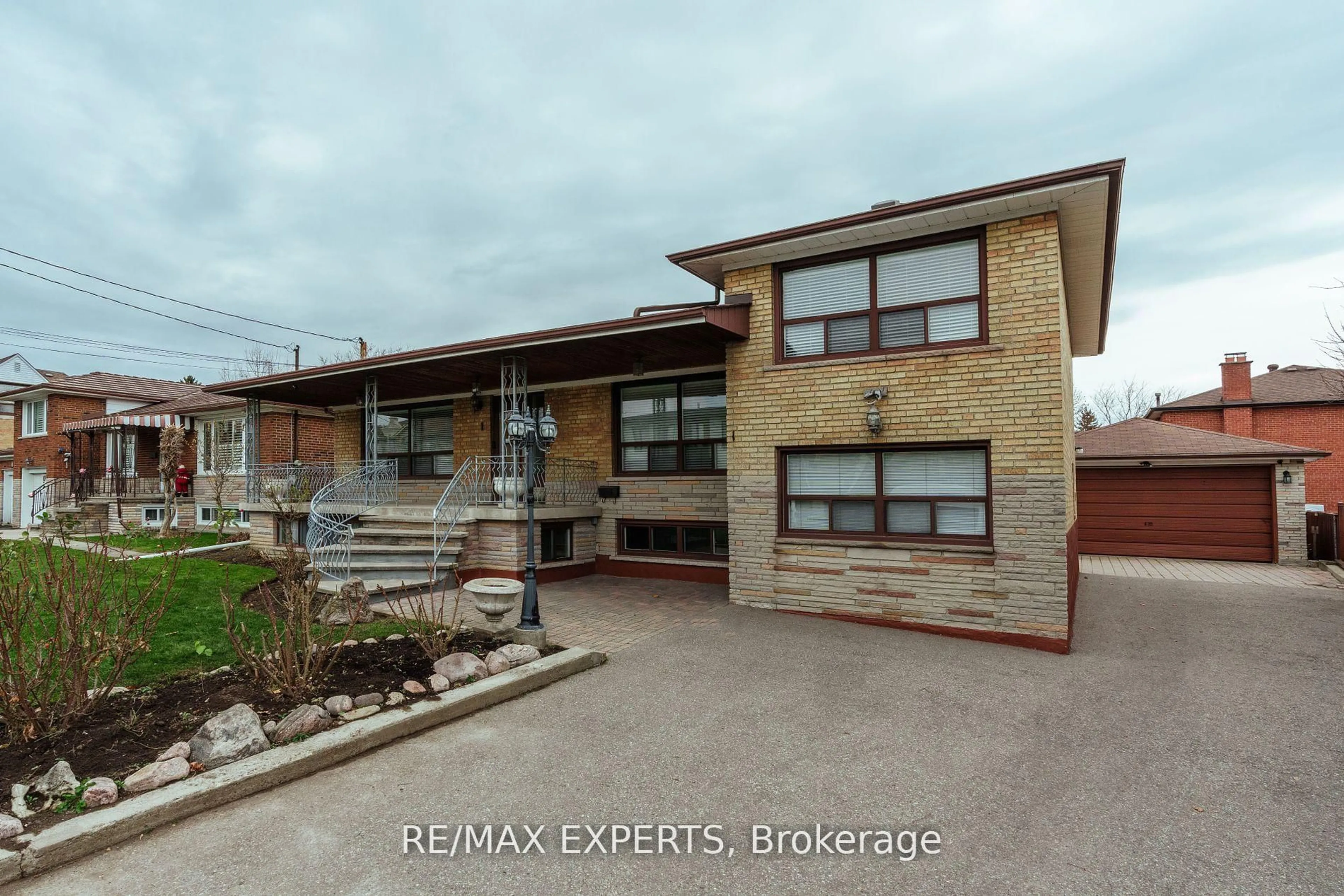 Home with brick exterior material, street for 1 Creston Rd, Toronto Ontario M6A 1H9