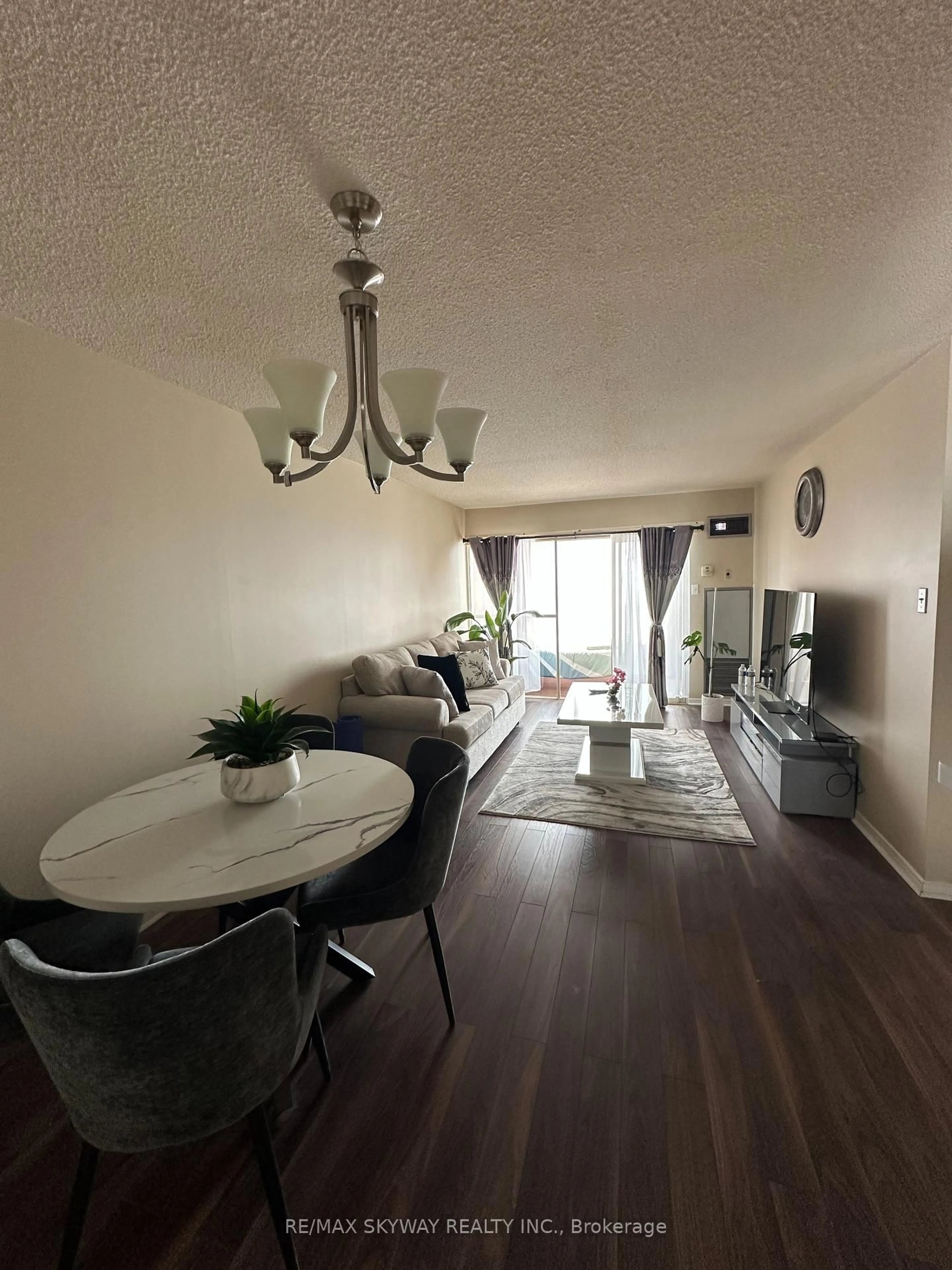 Living room with furniture, wood/laminate floor for 75 King St #1104, Mississauga Ontario L5A 4G5