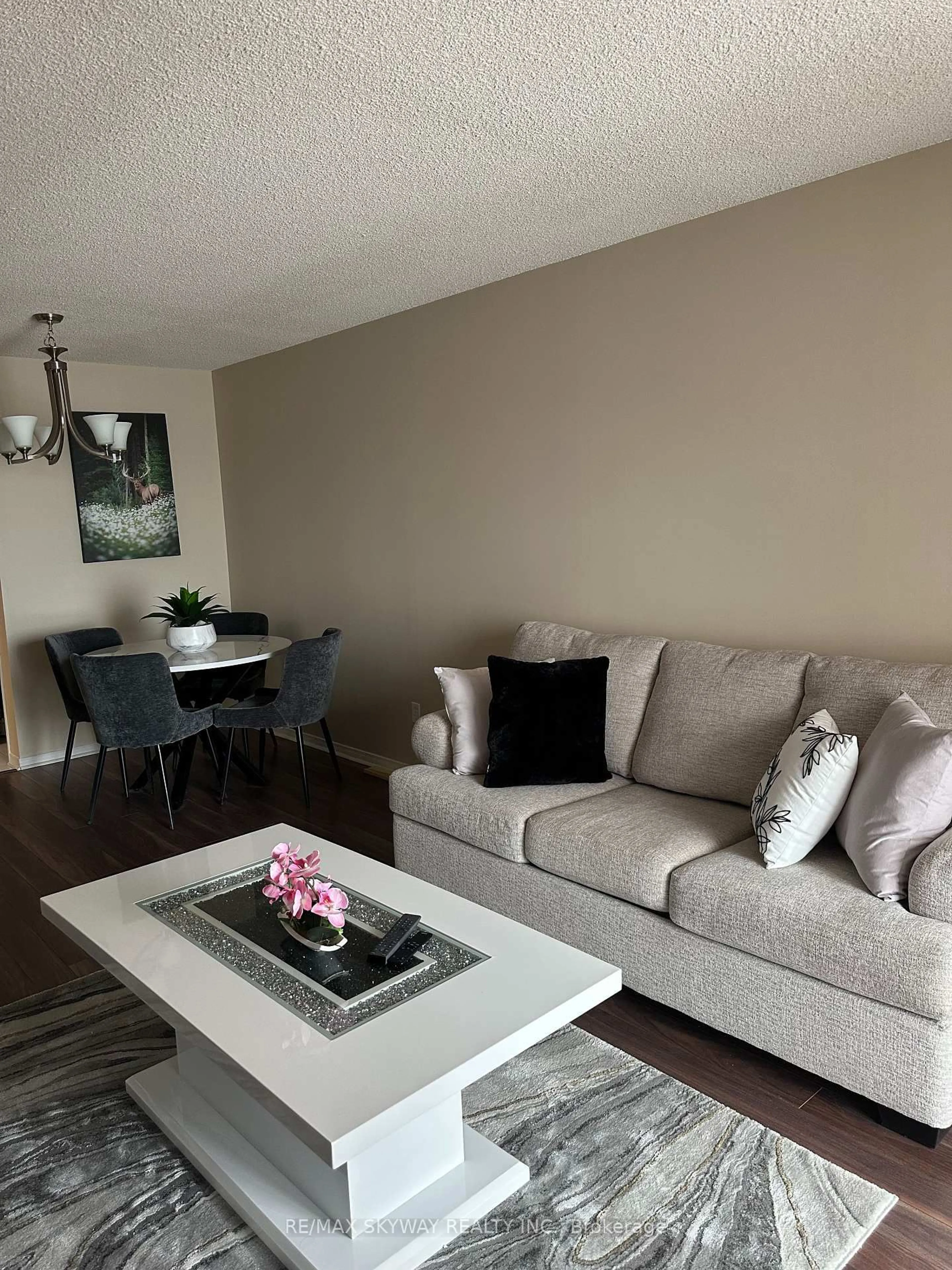 Living room with furniture, wood/laminate floor for 75 King St #1104, Mississauga Ontario L5A 4G5