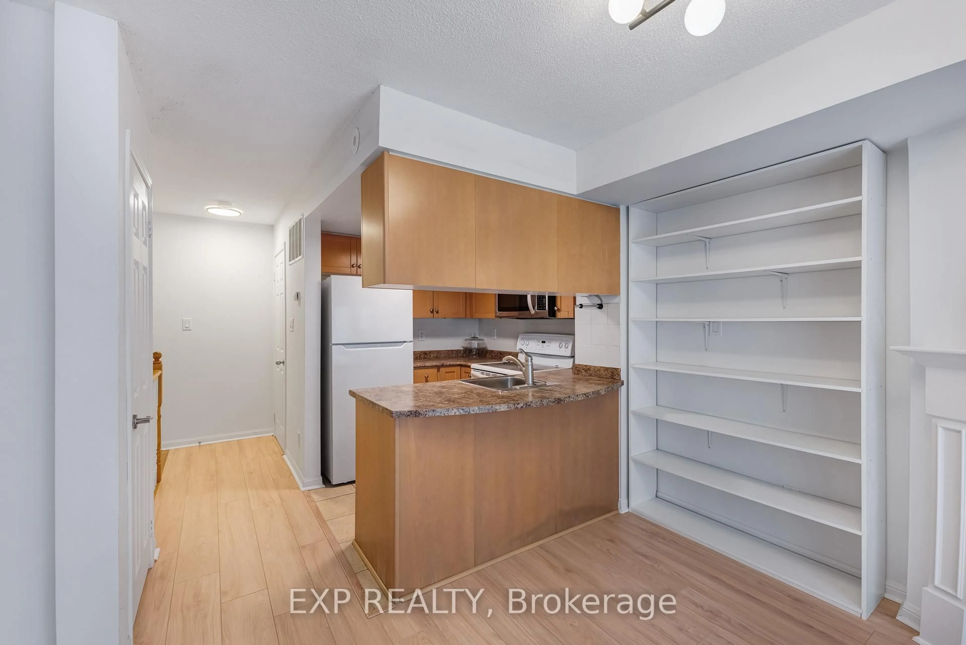 Standard kitchen, wood/laminate floor for 12 Laidlaw St #806, Toronto Ontario M6K 1X2