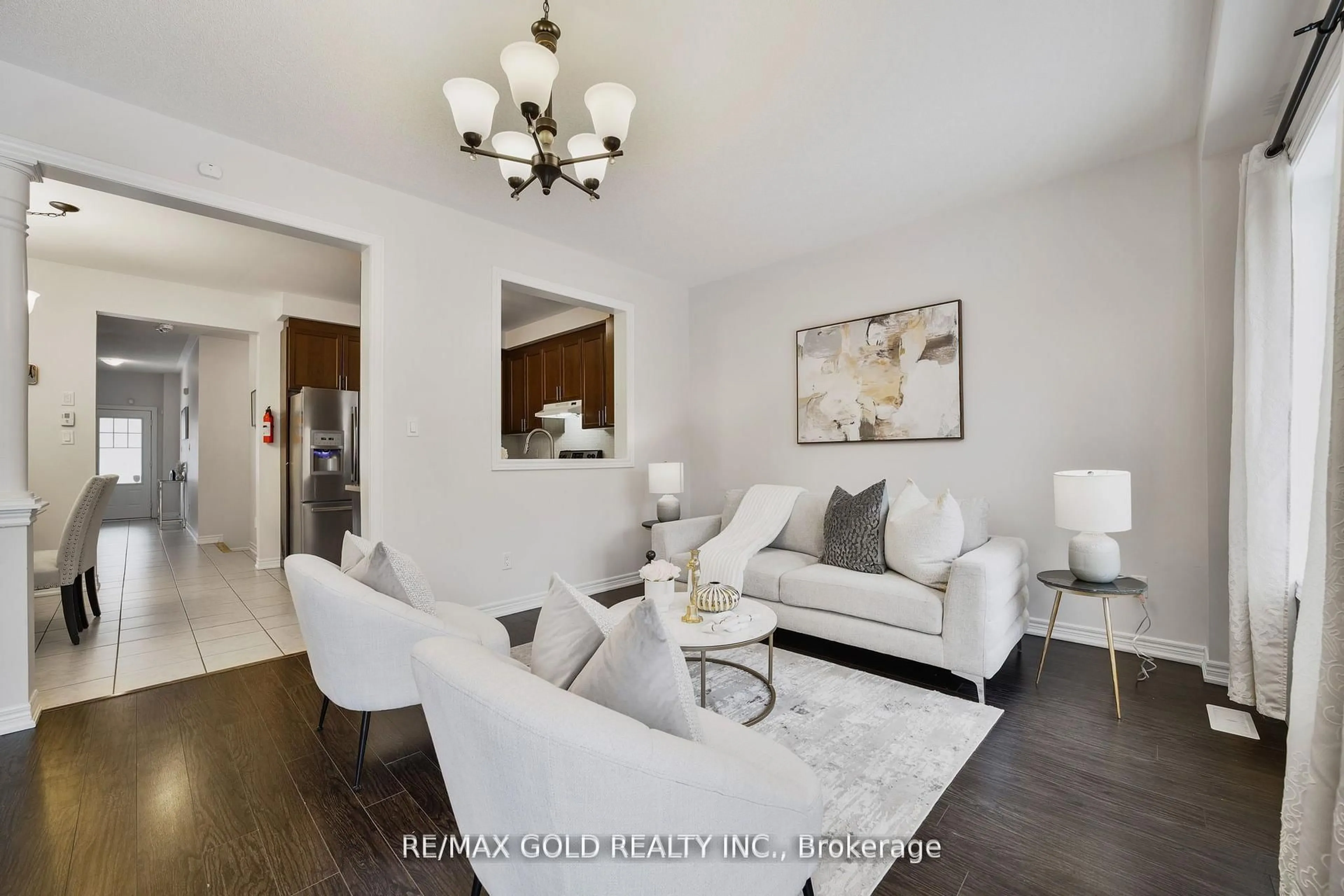 Living room with furniture, wood/laminate floor for 42 Lanark Circ, Brampton Ontario L6X 5L3