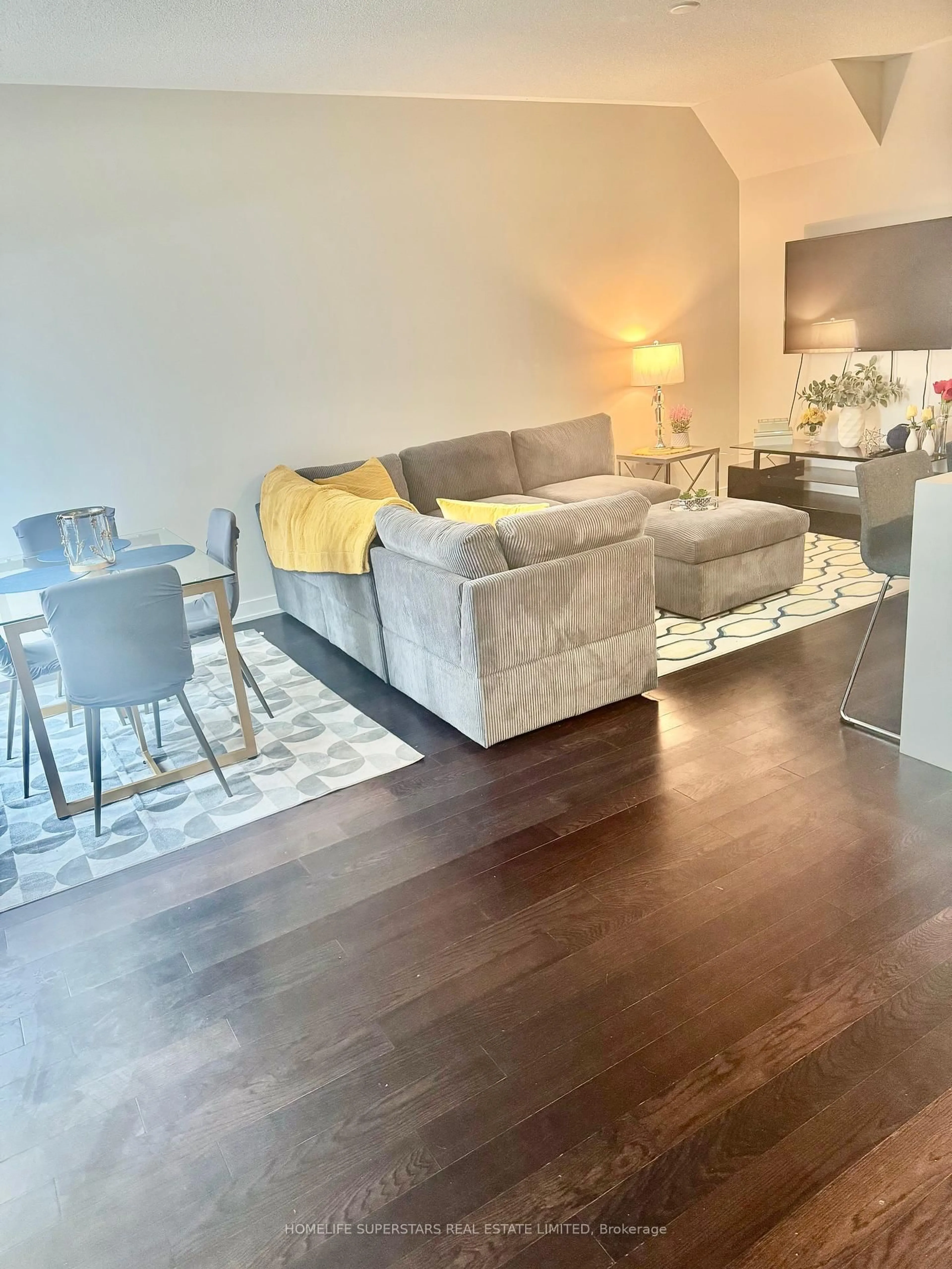 Living room with furniture, wood/laminate floor for 4070 Parkside Village Dr #TH 3, Mississauga Ontario L5B 0K2