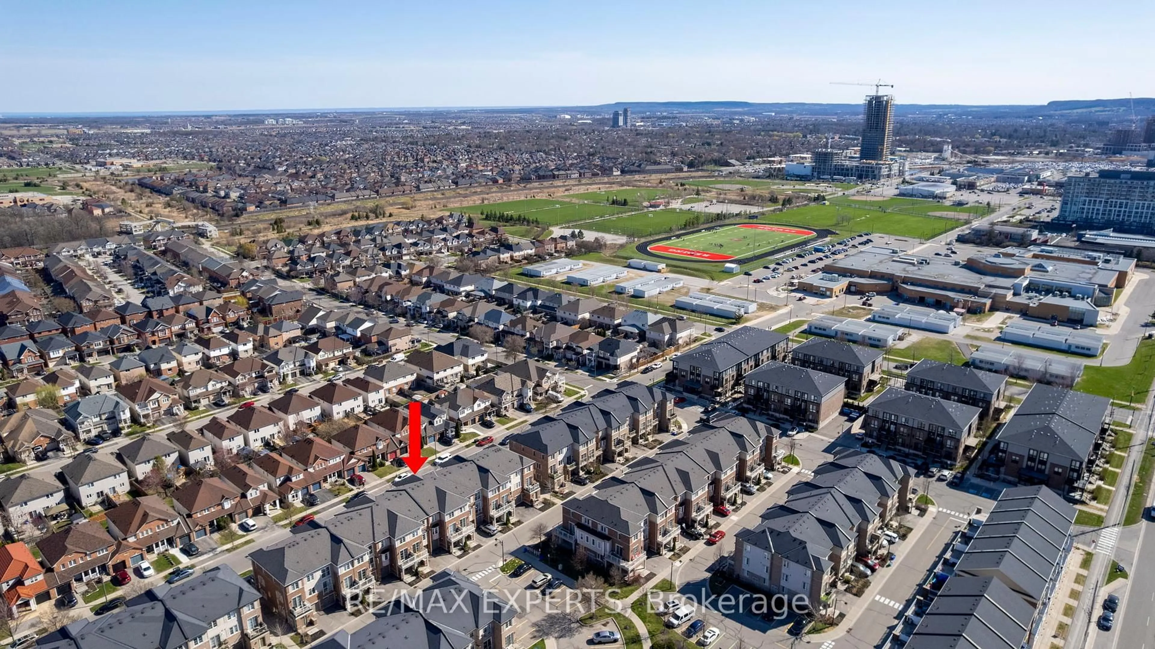 A pic from outside/outdoor area/front of a property/back of a property/a pic from drone, city buildings view from balcony for 165 Hampshire Way #130, Milton Ontario L9T 8M7