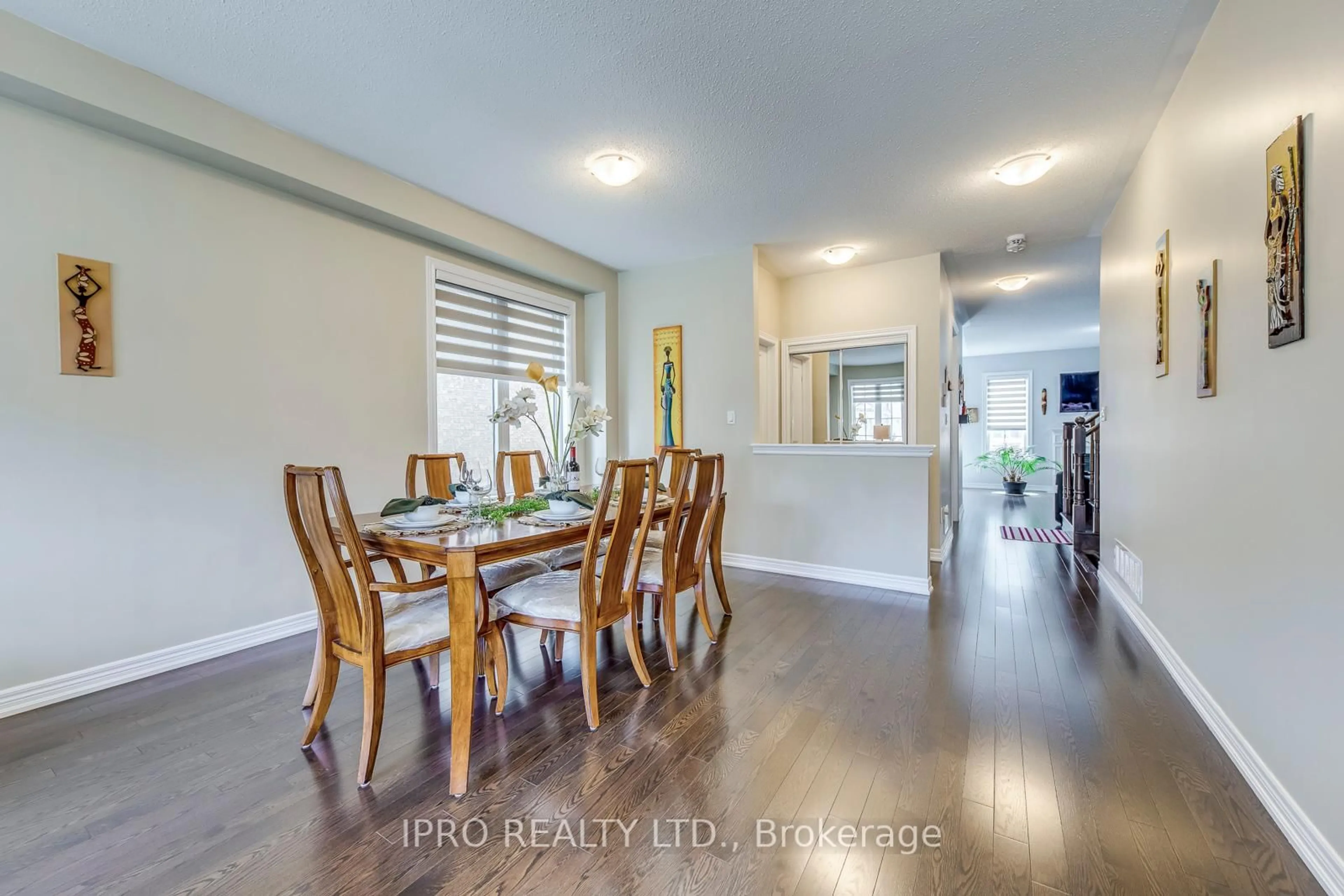 Dining room, wood/laminate floor for 11 Trentonian St, Brampton Ontario L6R 3W2