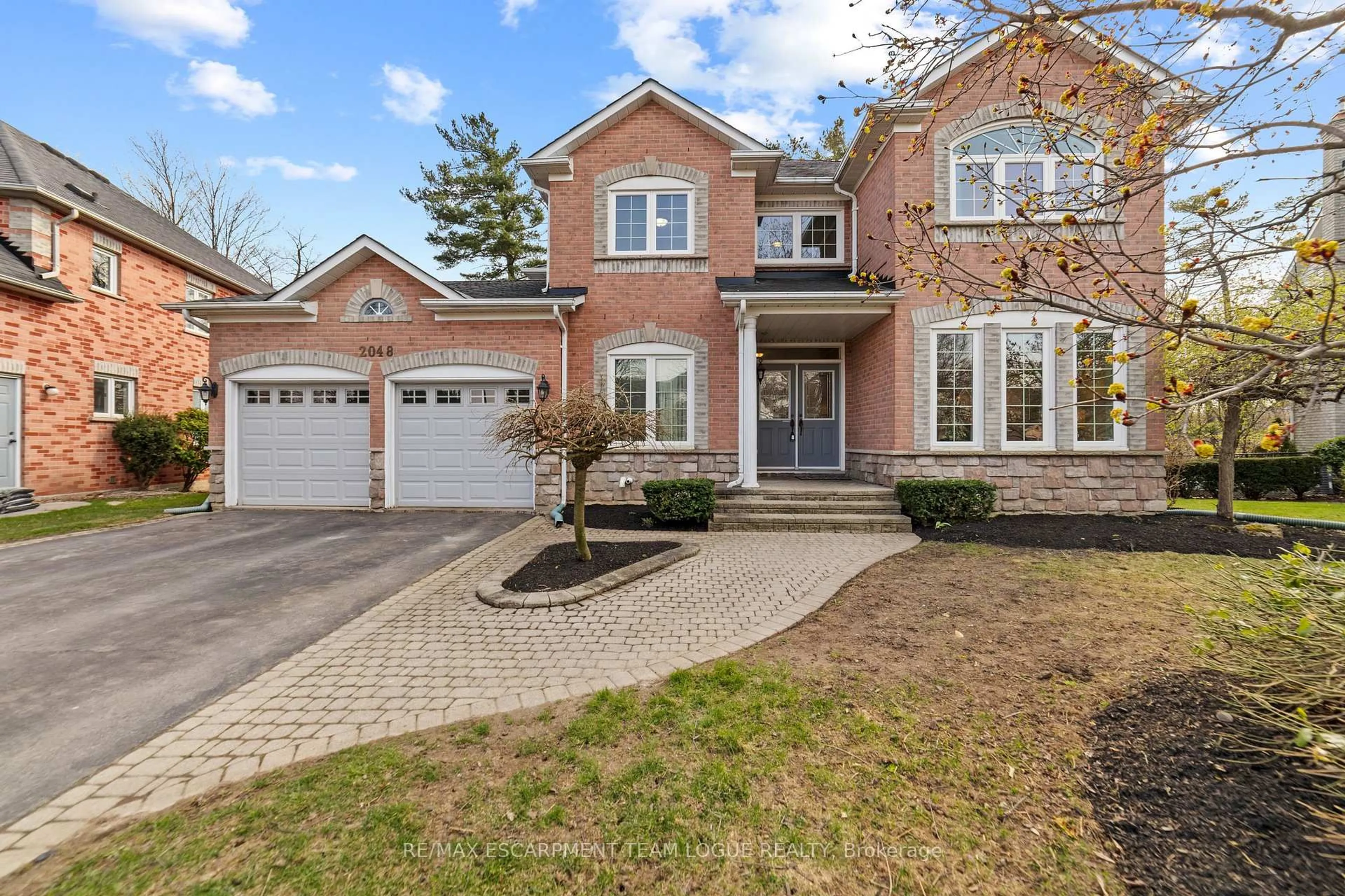 Home with brick exterior material, street for 2048 WATERBRIDGE Dr, Burlington Ontario L7M 3W2