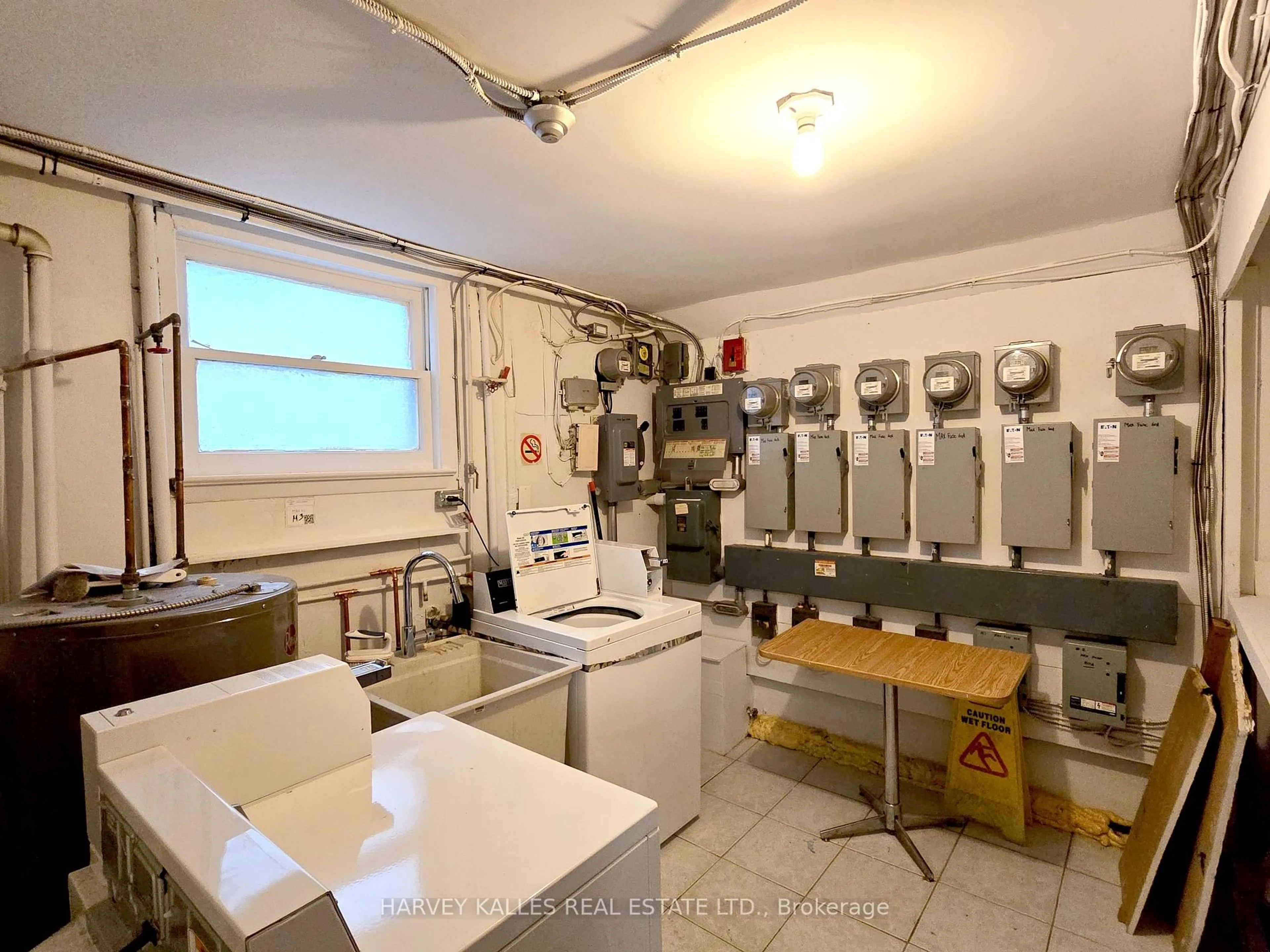 Kitchen with laundary machines, floor is not visible for 35 Third St, Toronto Ontario M8V 2X7