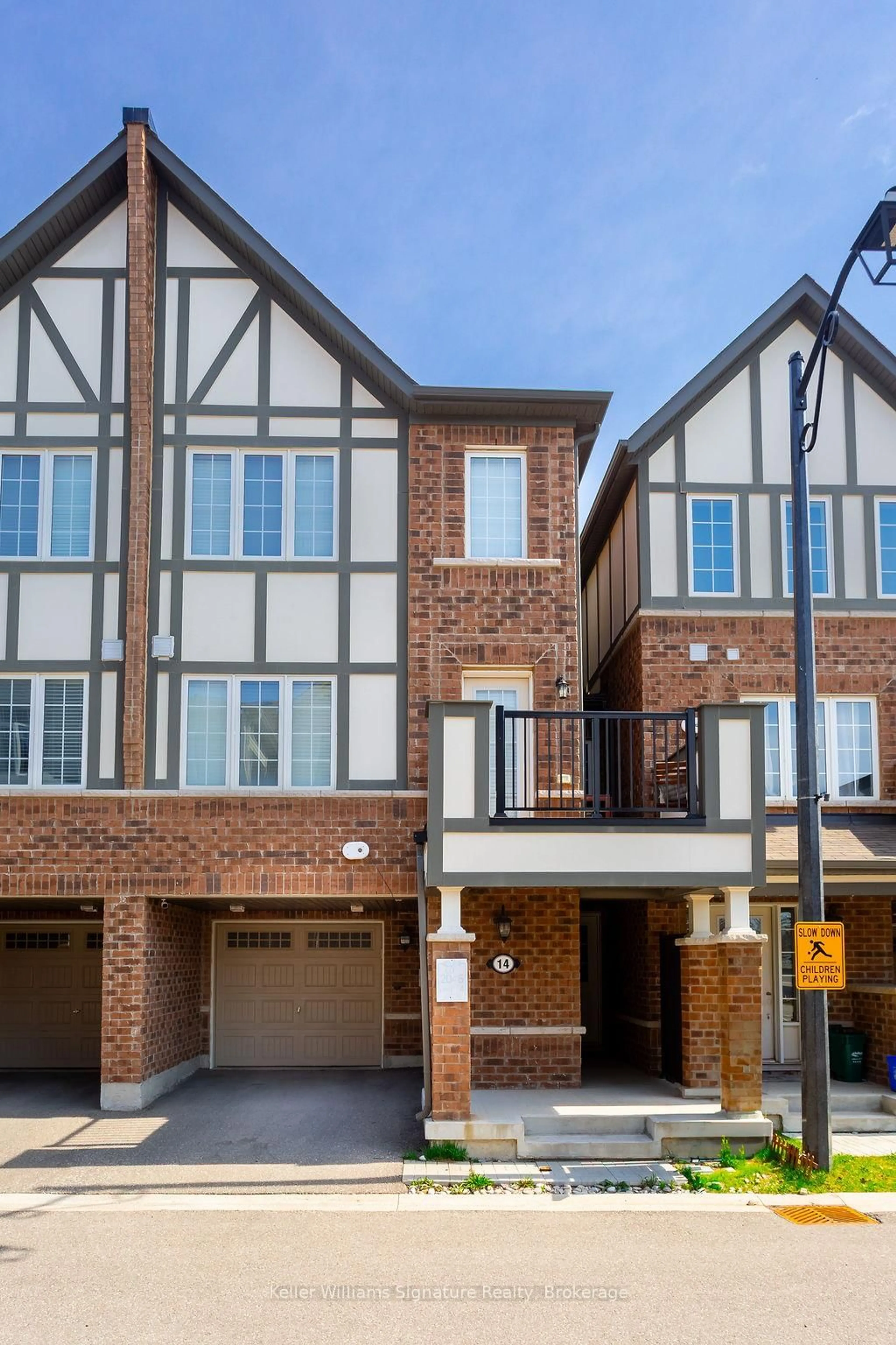 Home with brick exterior material, street for 1222 Rose Way #14, Milton Ontario L9E 1P2