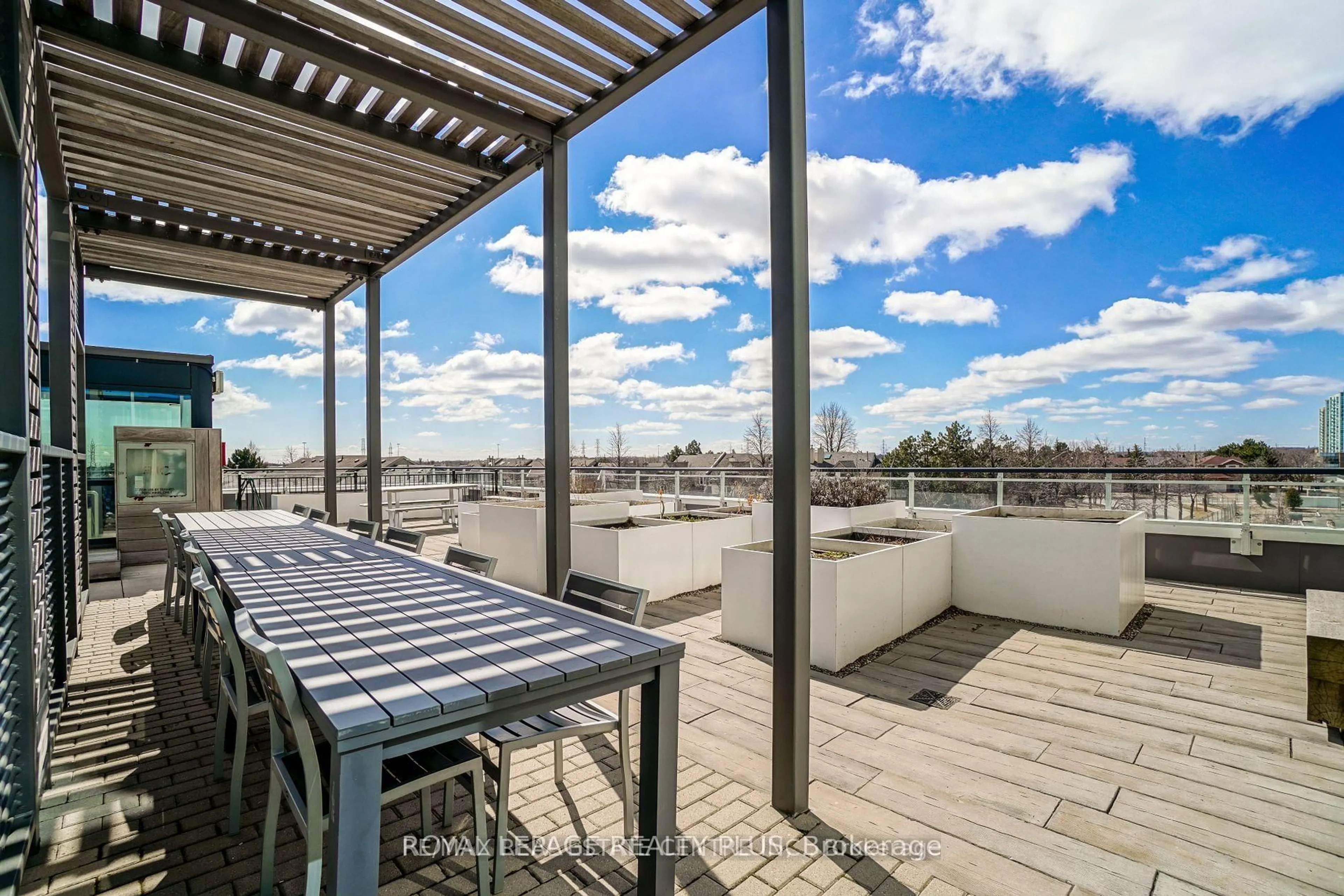 Patio, city buildings view from balcony for 2560 Eglinton Ave #Th-105, Mississauga Ontario L5M 0Y3