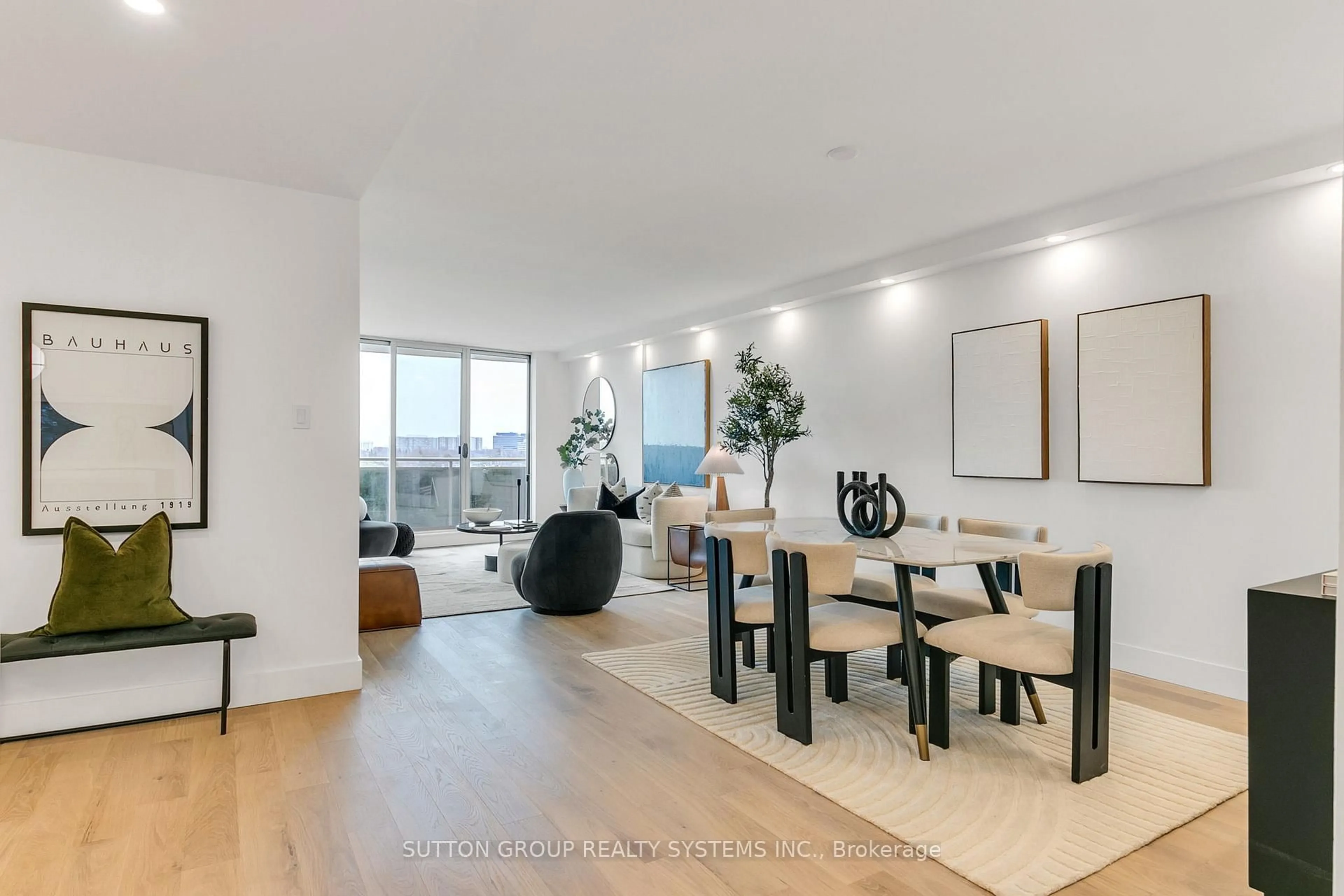 Living room with furniture, wood/laminate floor for 820 Burnhamthorpe Rd #808, Toronto Ontario M9C 4W2