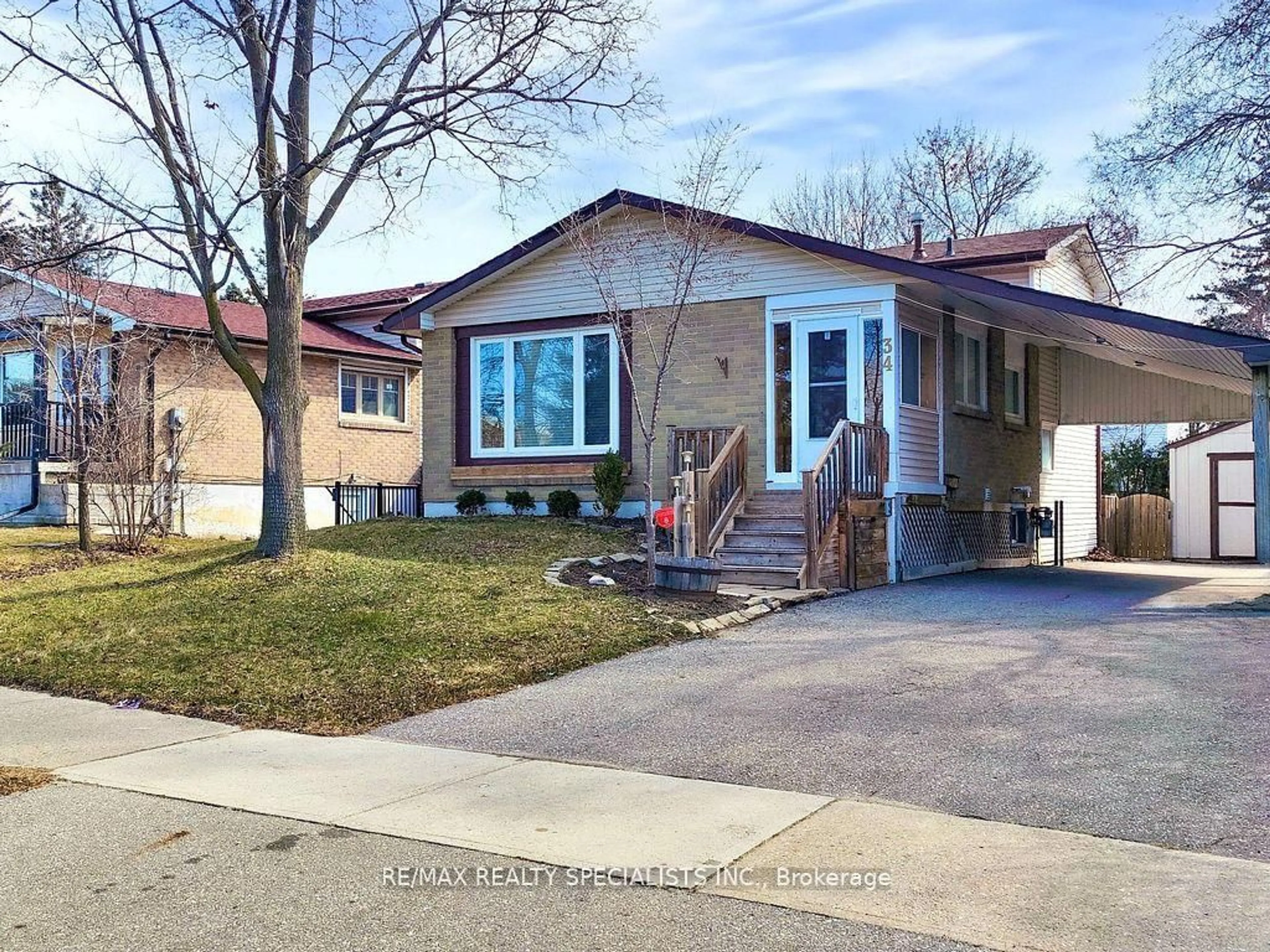 Home with vinyl exterior material, street for 34 Madoc Dr, Brampton Ontario L6V 1Z9