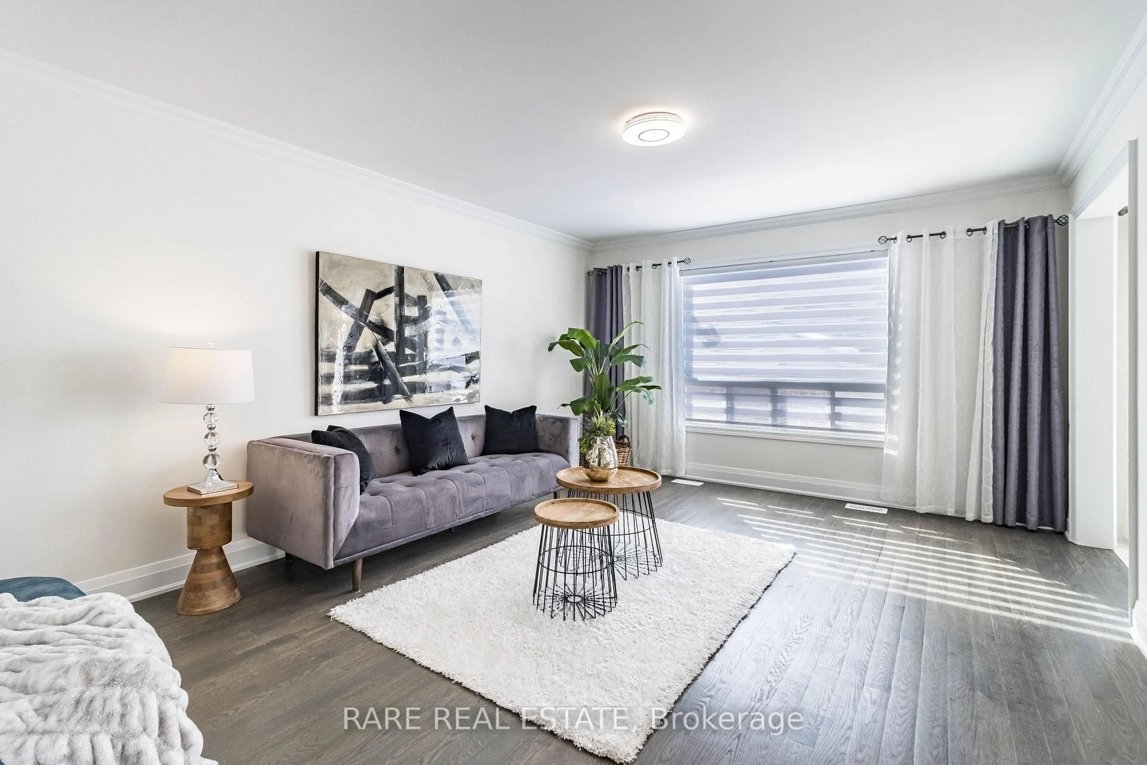 Living room with furniture, wood/laminate floor for 46 Bottomwood St, Brampton Ontario L6S 0B3
